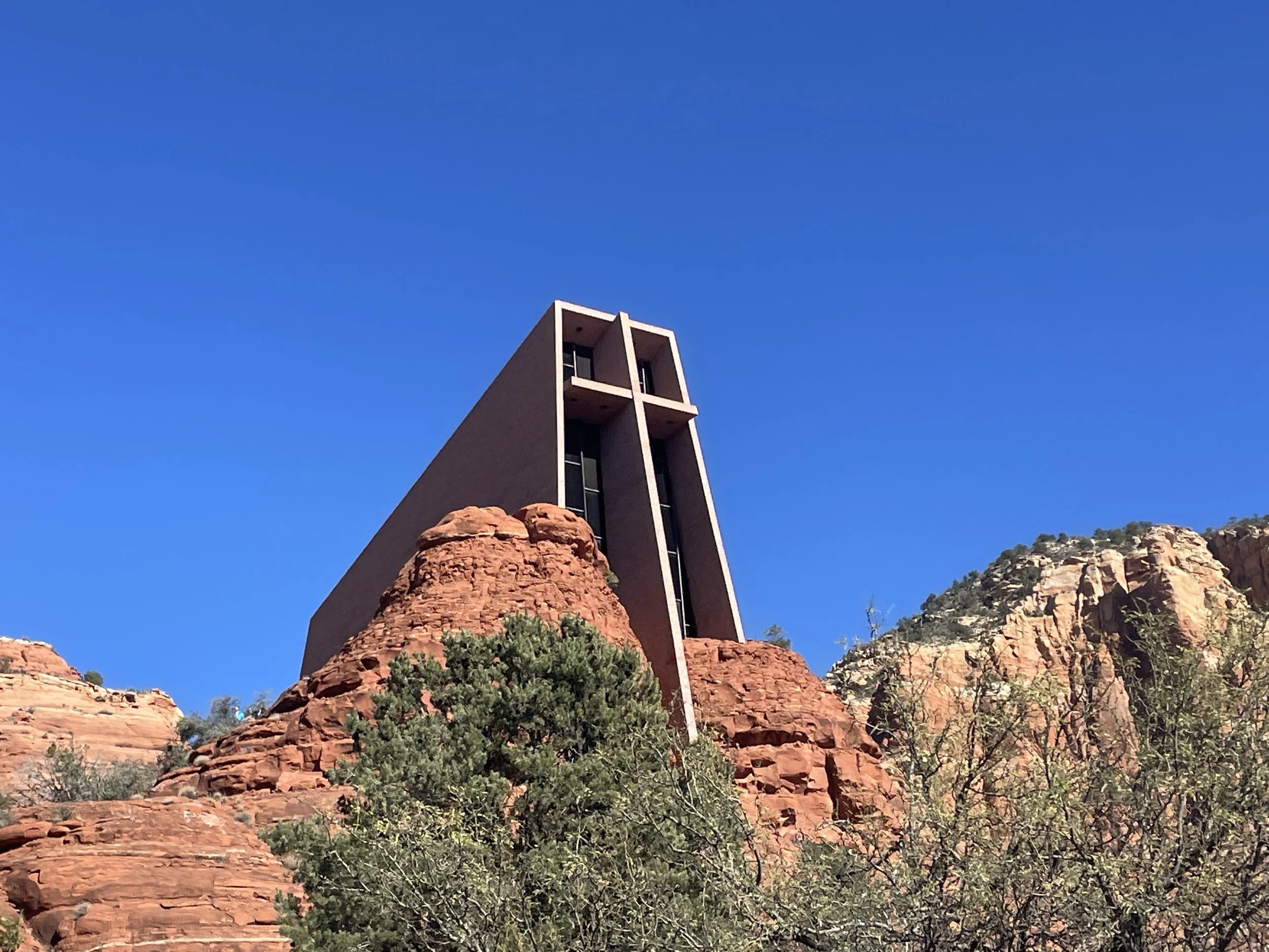 A Christian church — the Chapel of the Holy Cross — is considered the strongest vortex in Sedona, Arizona, by the Center for the New Age. This image is taken from the outside of the church and shows a large cross on the south-facing exterior wall.