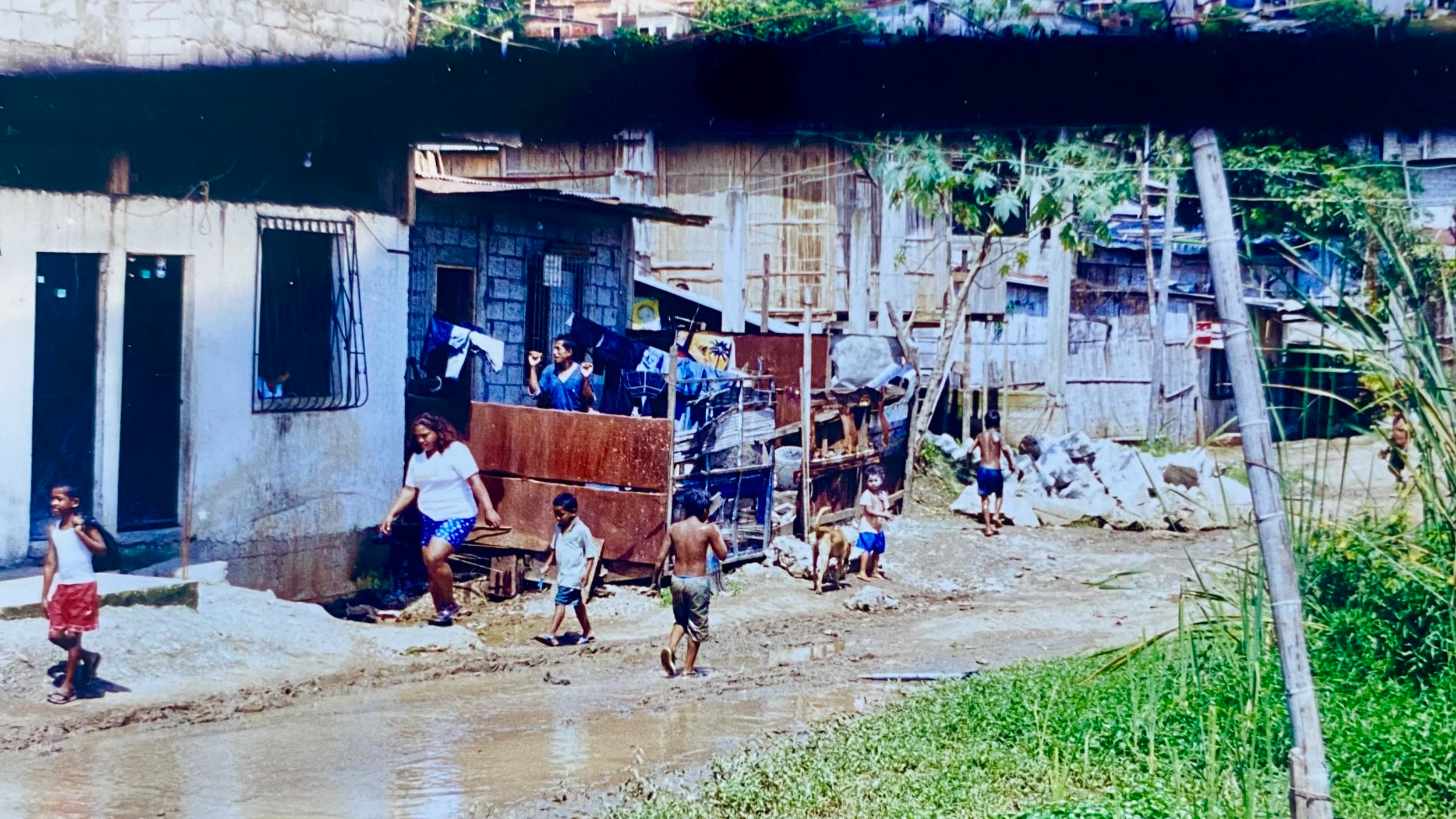 A view of the street from the church window where Timothy served as a missionary in Ecuador. Children play in a muddy street.