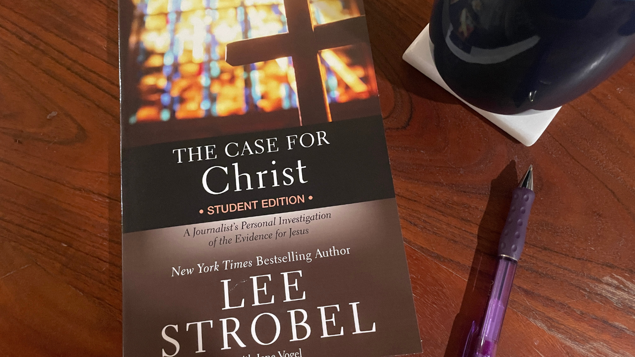 The "Case for Christ: Student Edition" book sits on Christian author Mackenzie Ryan Walter's coffee table next to a purple pen and cup of tea.