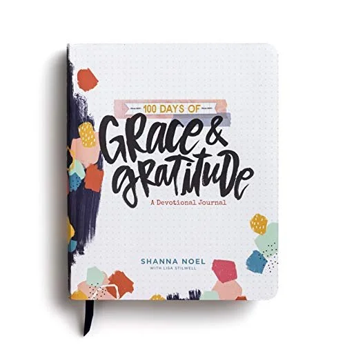 Book cover of "100 Days of Grace & Gratitude: A Devotional Journal" by Shanna Noel and Lisa Stilwell. It's on our list of devotional journal and bible combo.