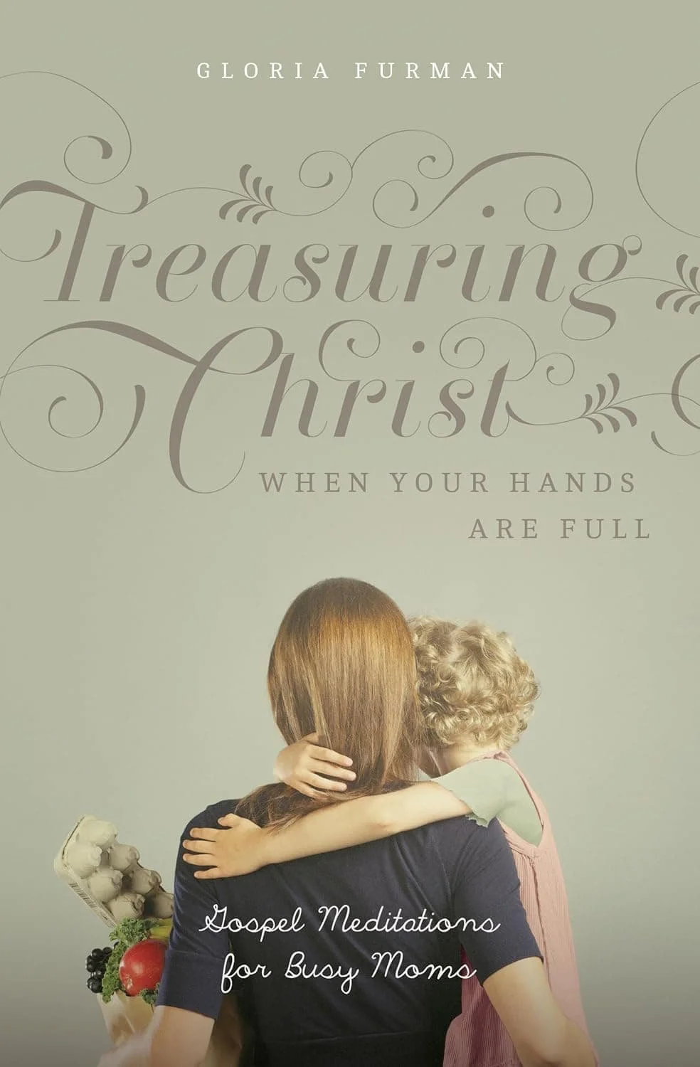 Book cover of “Treasuring Christ When Your Hands Are Full” by Gloria Furman is on our list for Christian motherhood books.