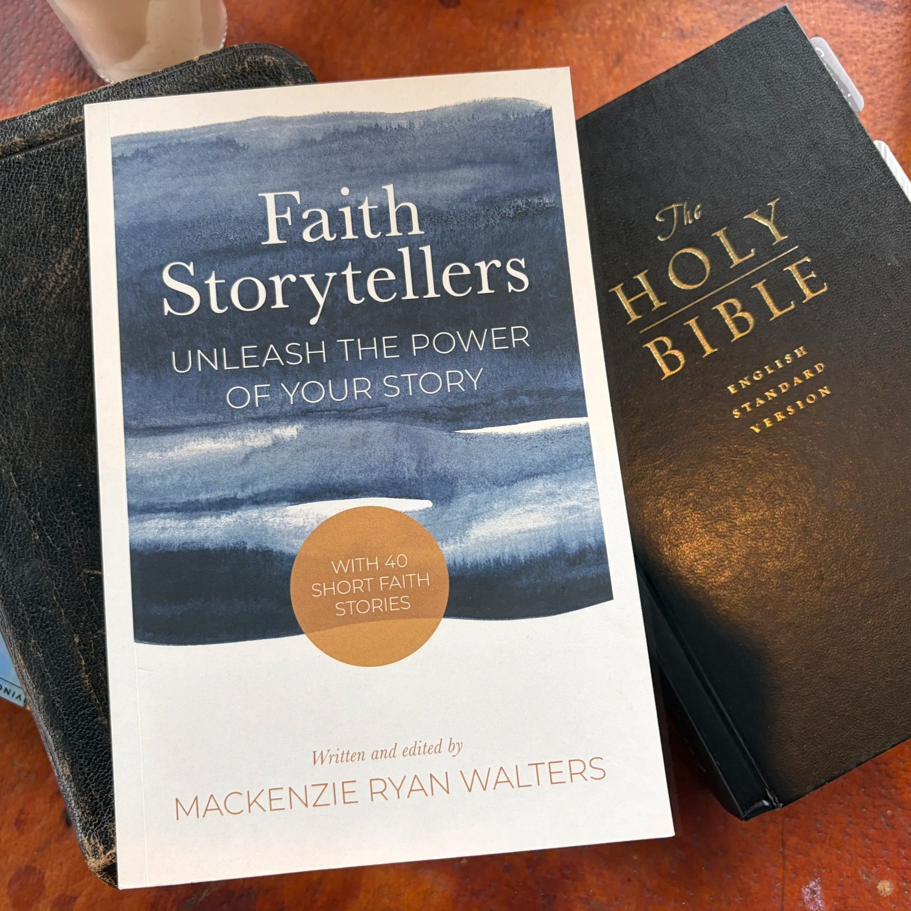 The “Faith Storytellers” book rests near a Bible. But this Christian testimonies book for its inspirational personal stories of faith and learn how to write your own testimony with its writing guidance.
