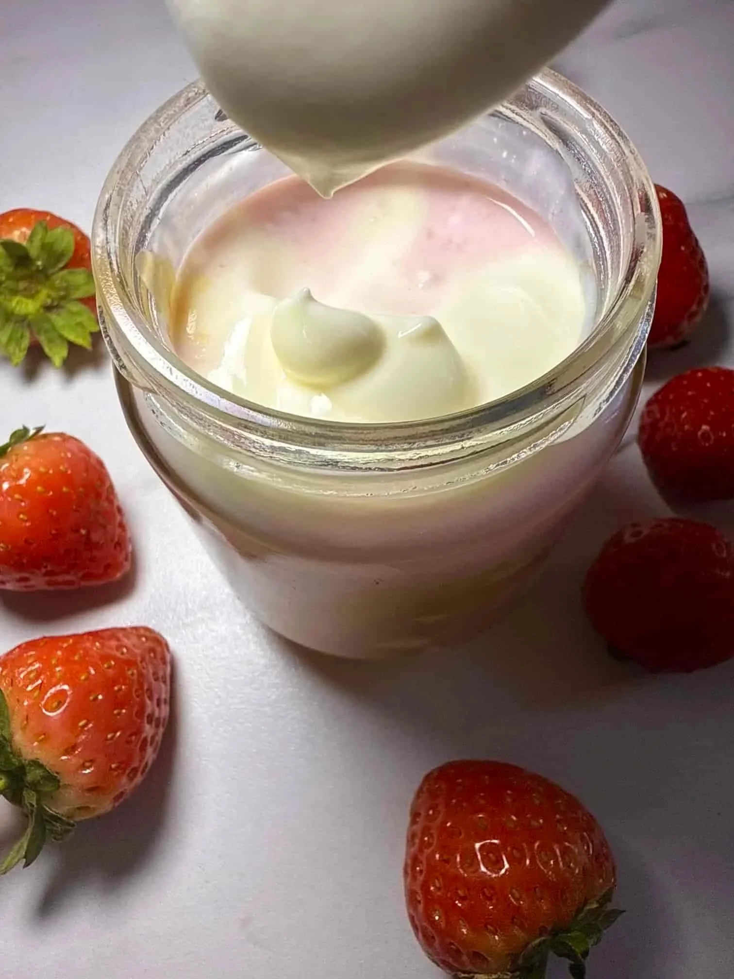 Cottage cheese, strawberries and Greek yogurt combined with a swirl of peanut butter and served in a jar with fresh strawberries