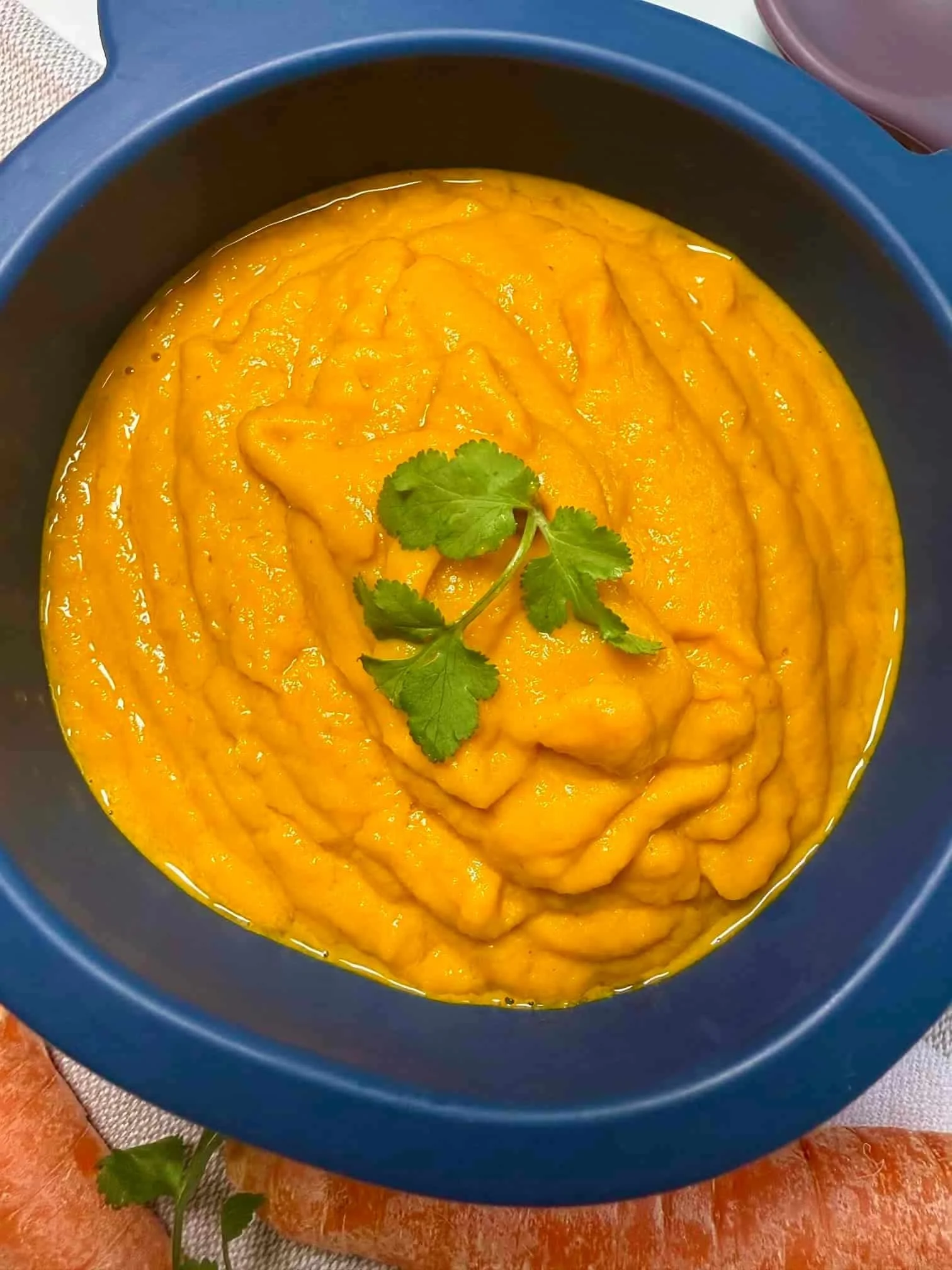 A toddler sized serving of carrot soup