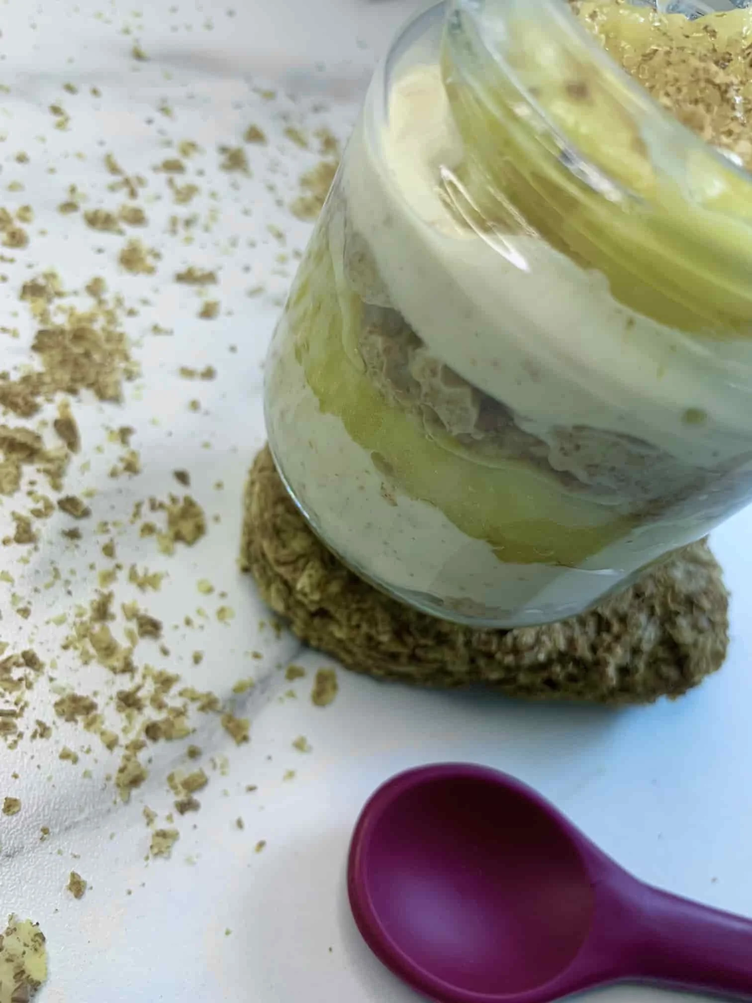 Weetabix and banana pudding served in a jar showing the two layers