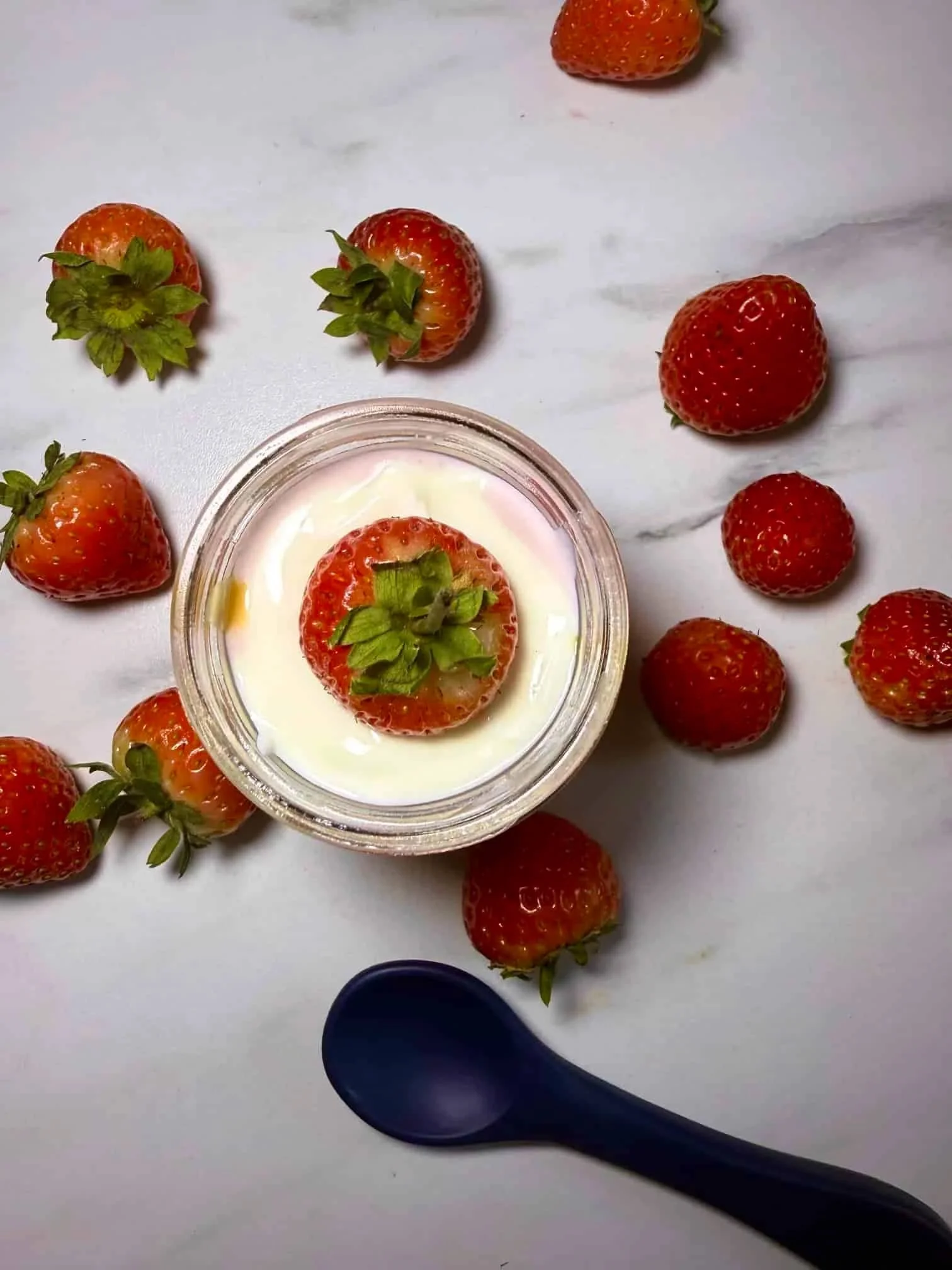 Cottage cheese, strawberries and Greek yogurt combined with a swirl of peanut butter and served in a jar with fresh strawberries
