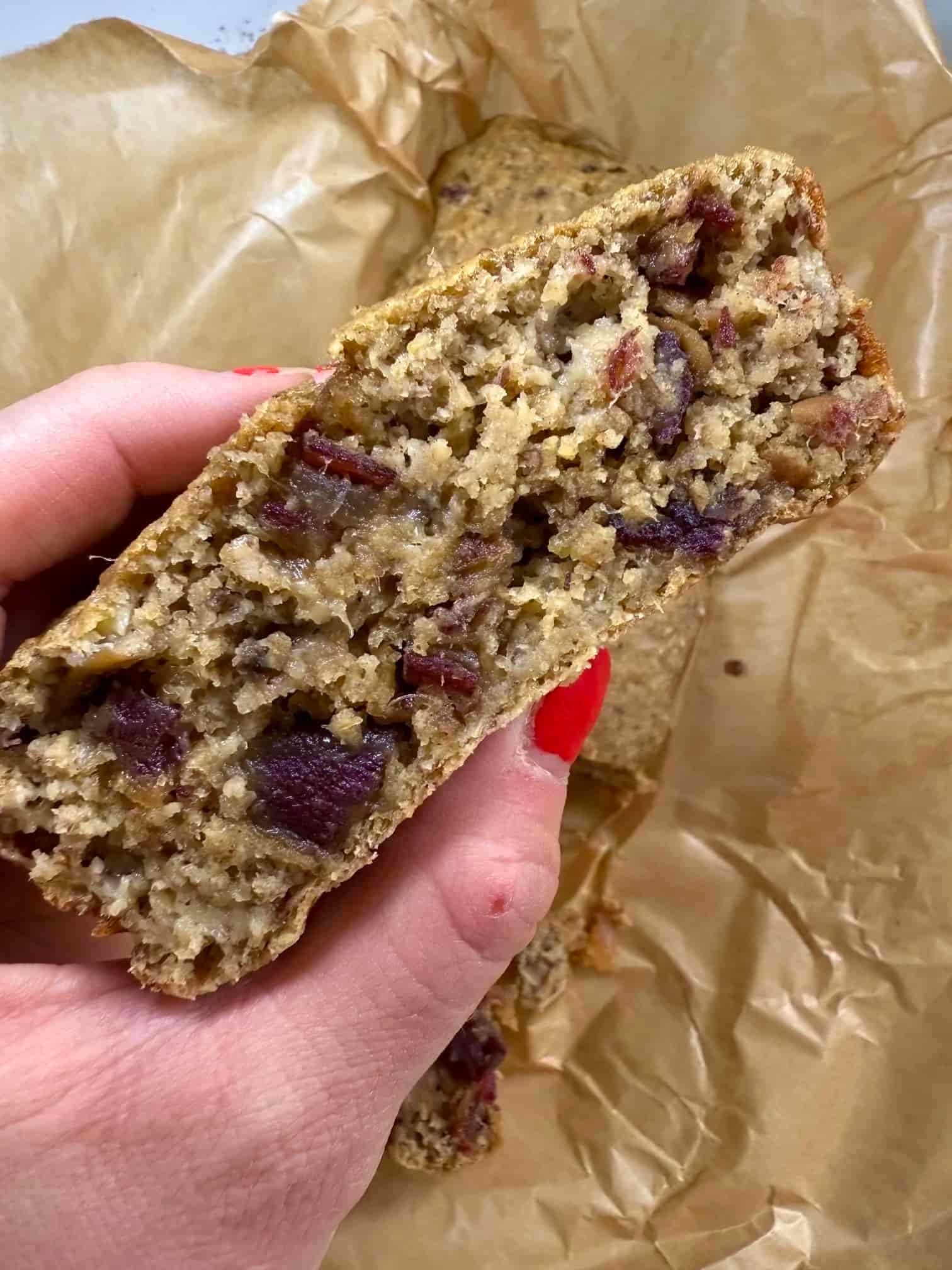 Close up image of a slice of cooked date and banana loaf