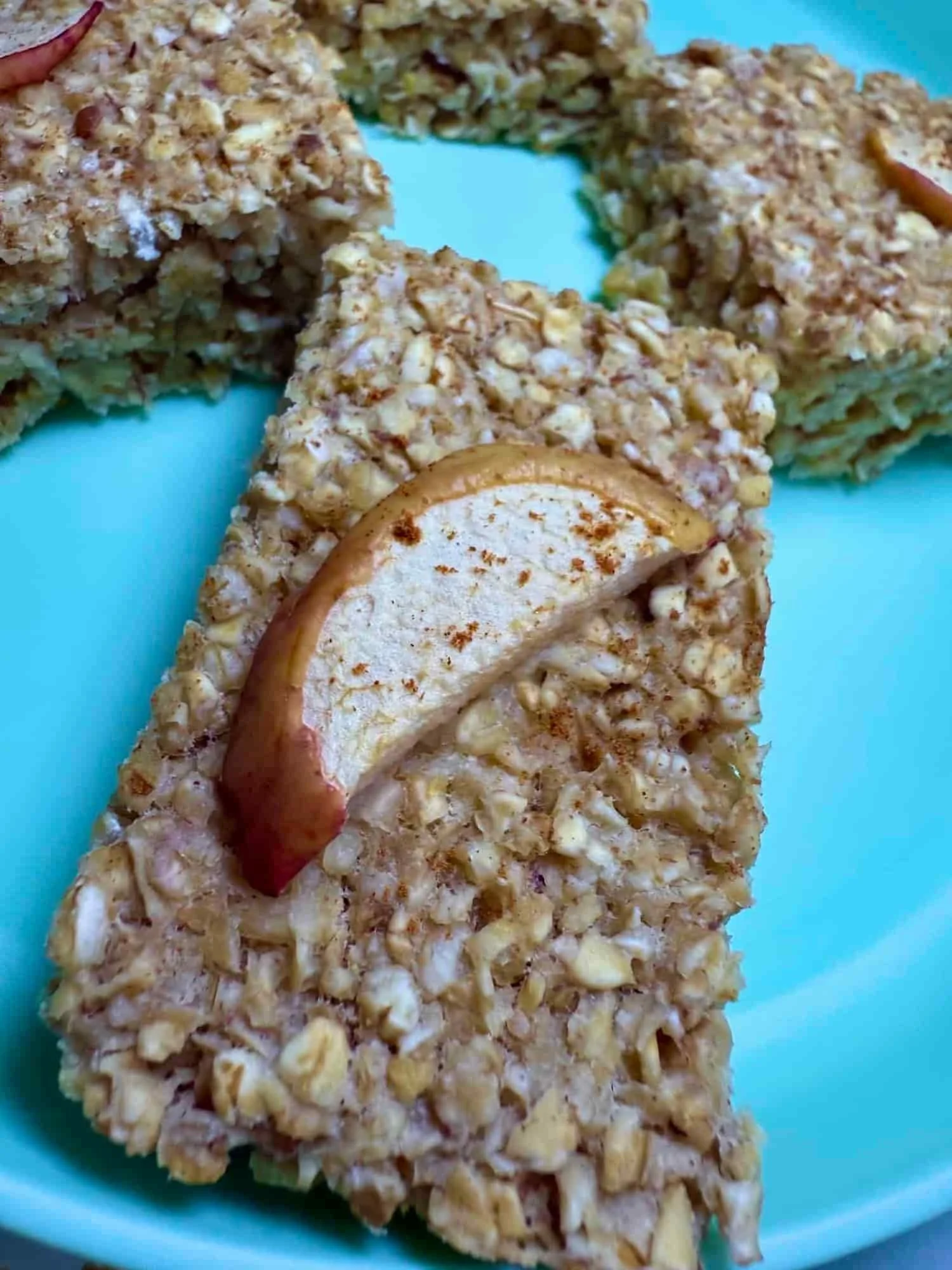 Several apple flapjacks with cinnamon on toddler plate