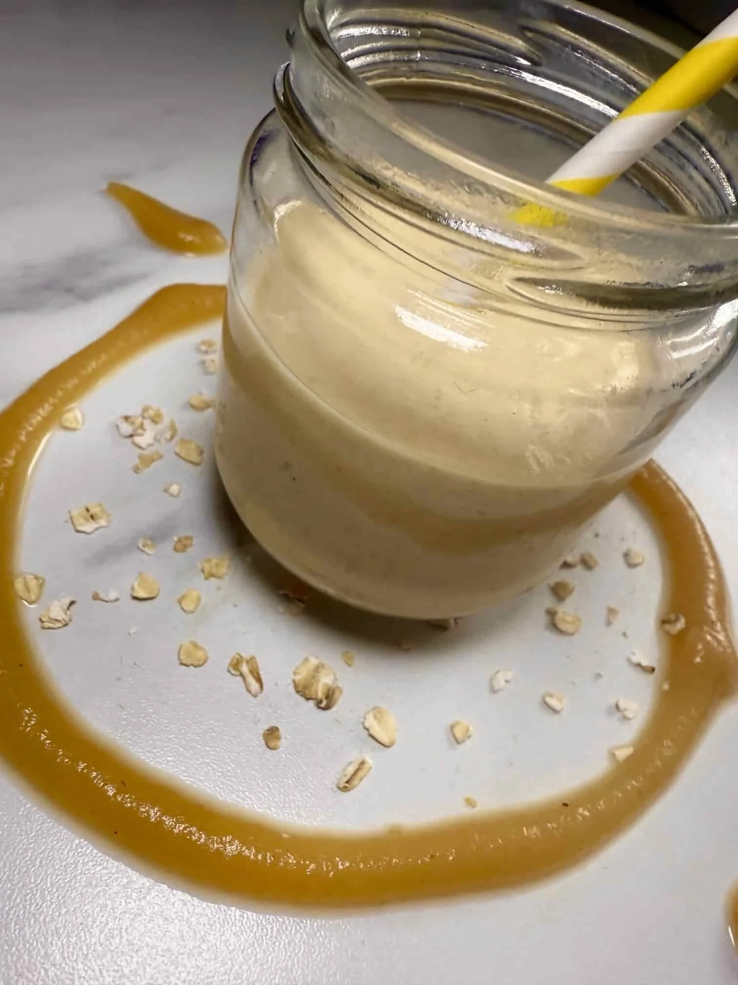 Apple and oat smoothie for baby and toddler served in a jar with pureed apple