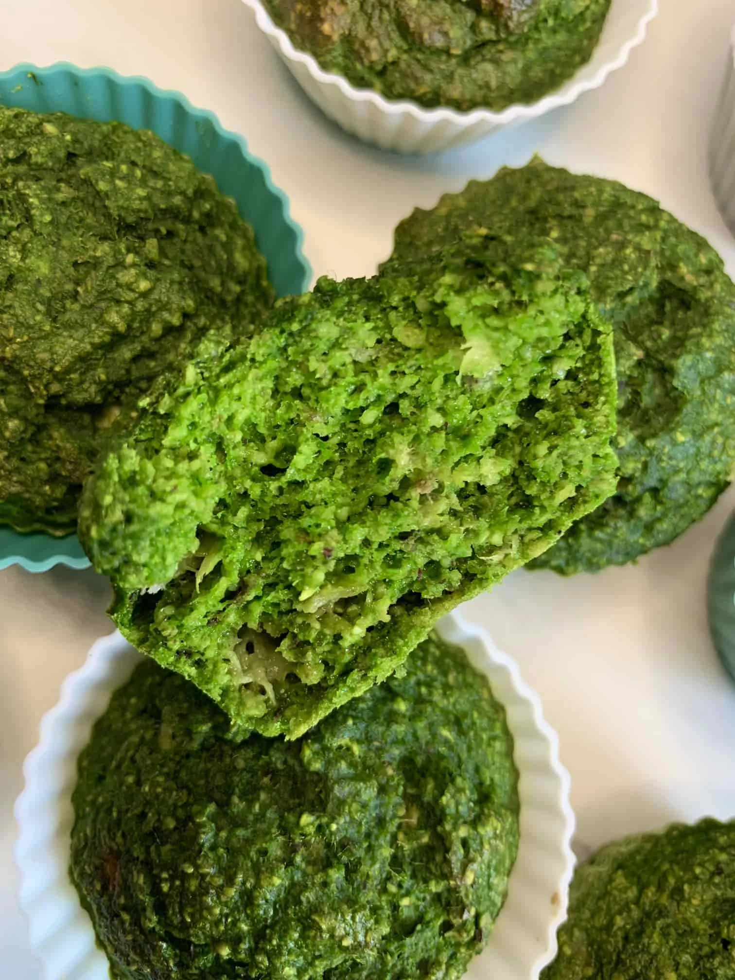 An overhead image of several spinach muffins especially for baby led weaning