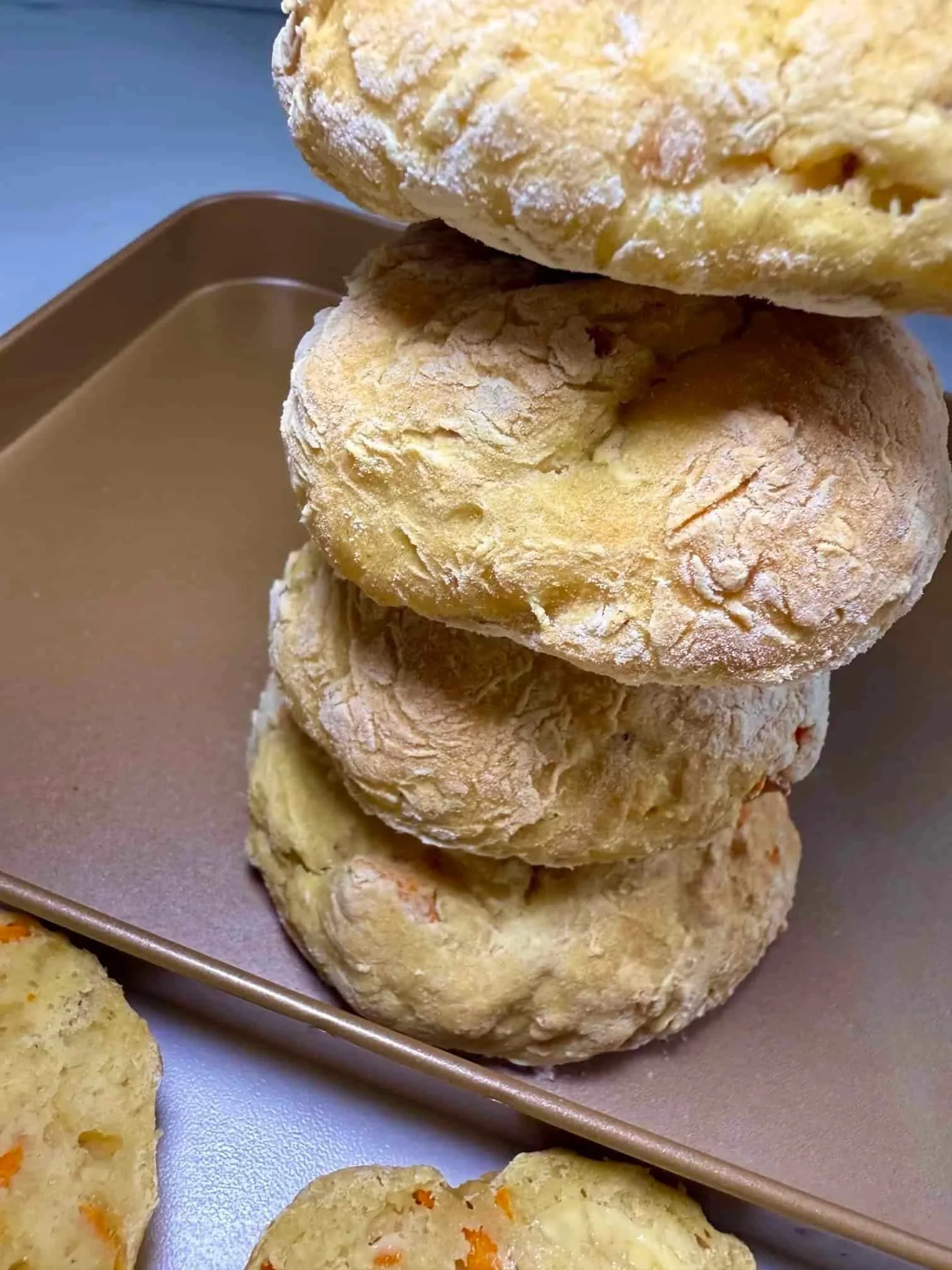 A stack of baked ABC bagels on baking tray