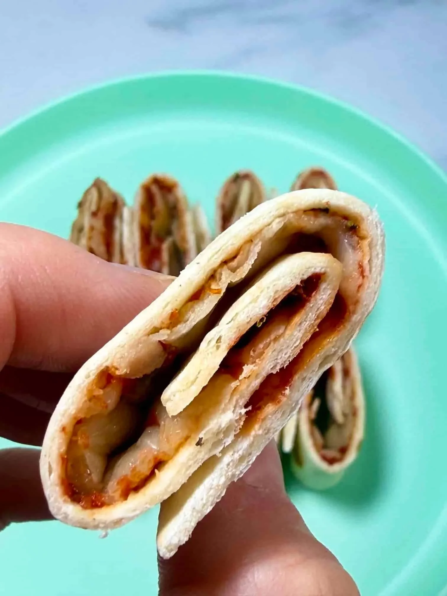 Close up image of a tortilla pizza roll up