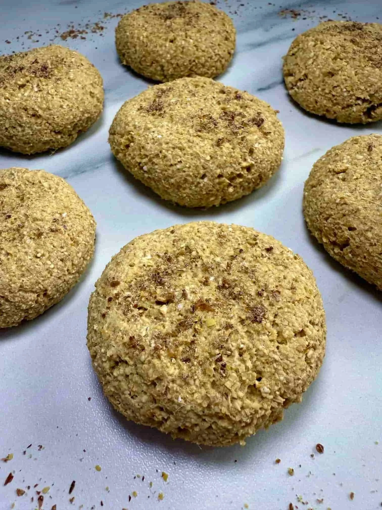 Several cooked mango cookies displayed on serving board
