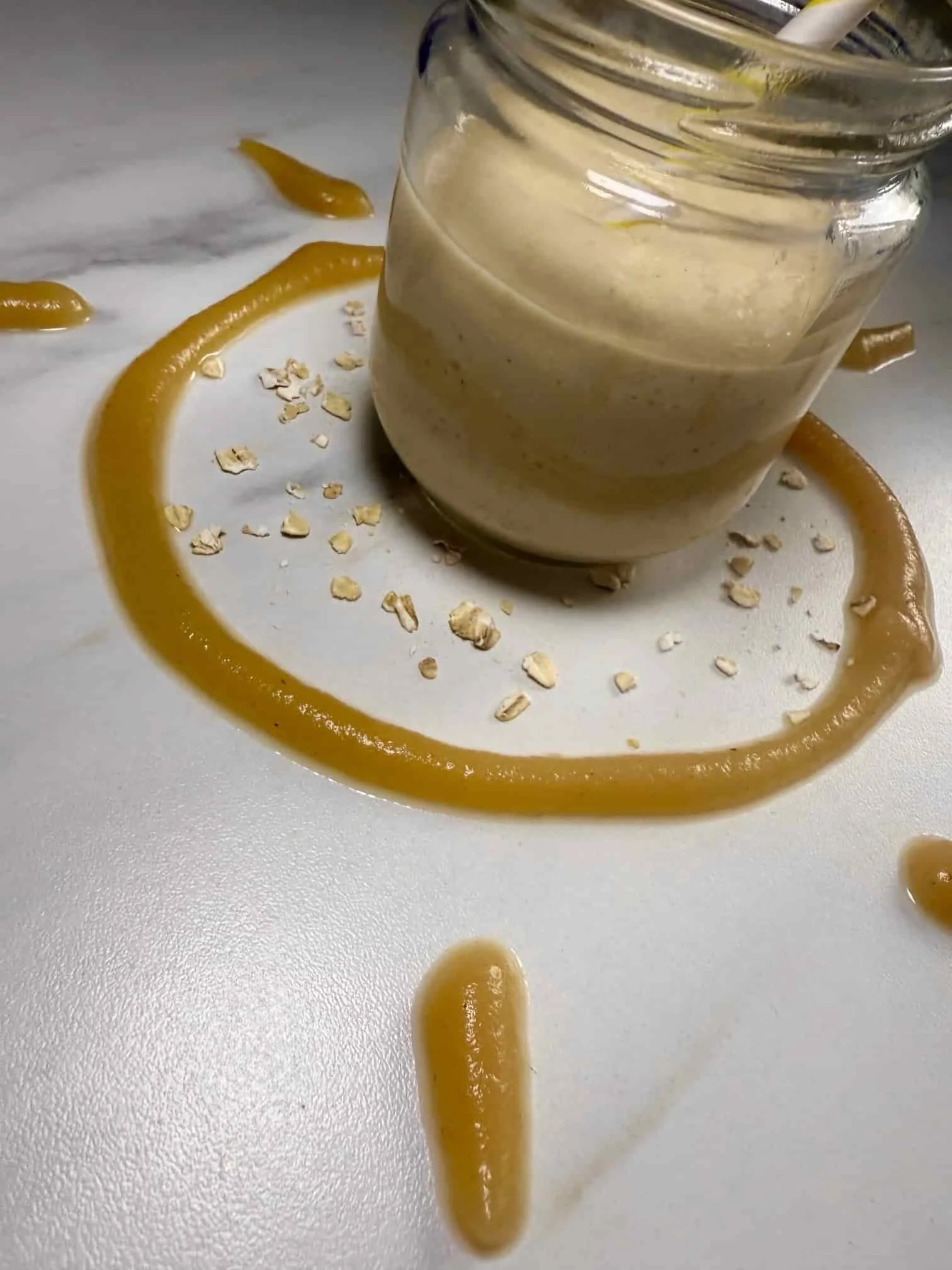 Apple and oat smoothie for baby and toddler served in a jar with pureed apple