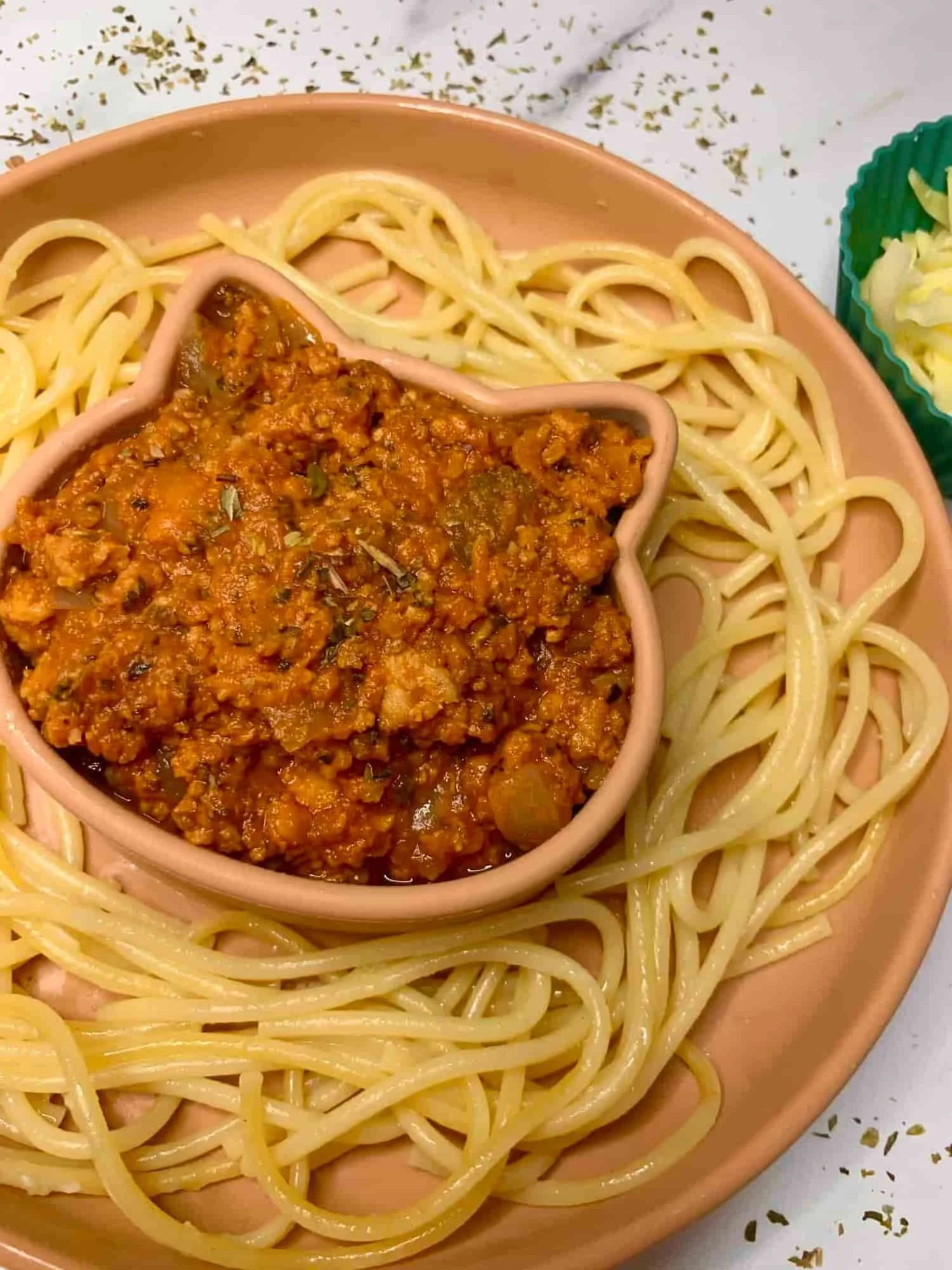 Slow cooked chicken spaghetti served in partitioned toddler bowl