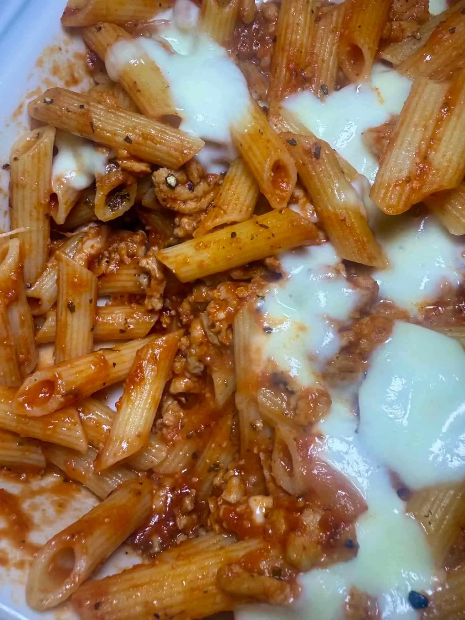 A portion of chicken mince penne pasta served in a toddler dish