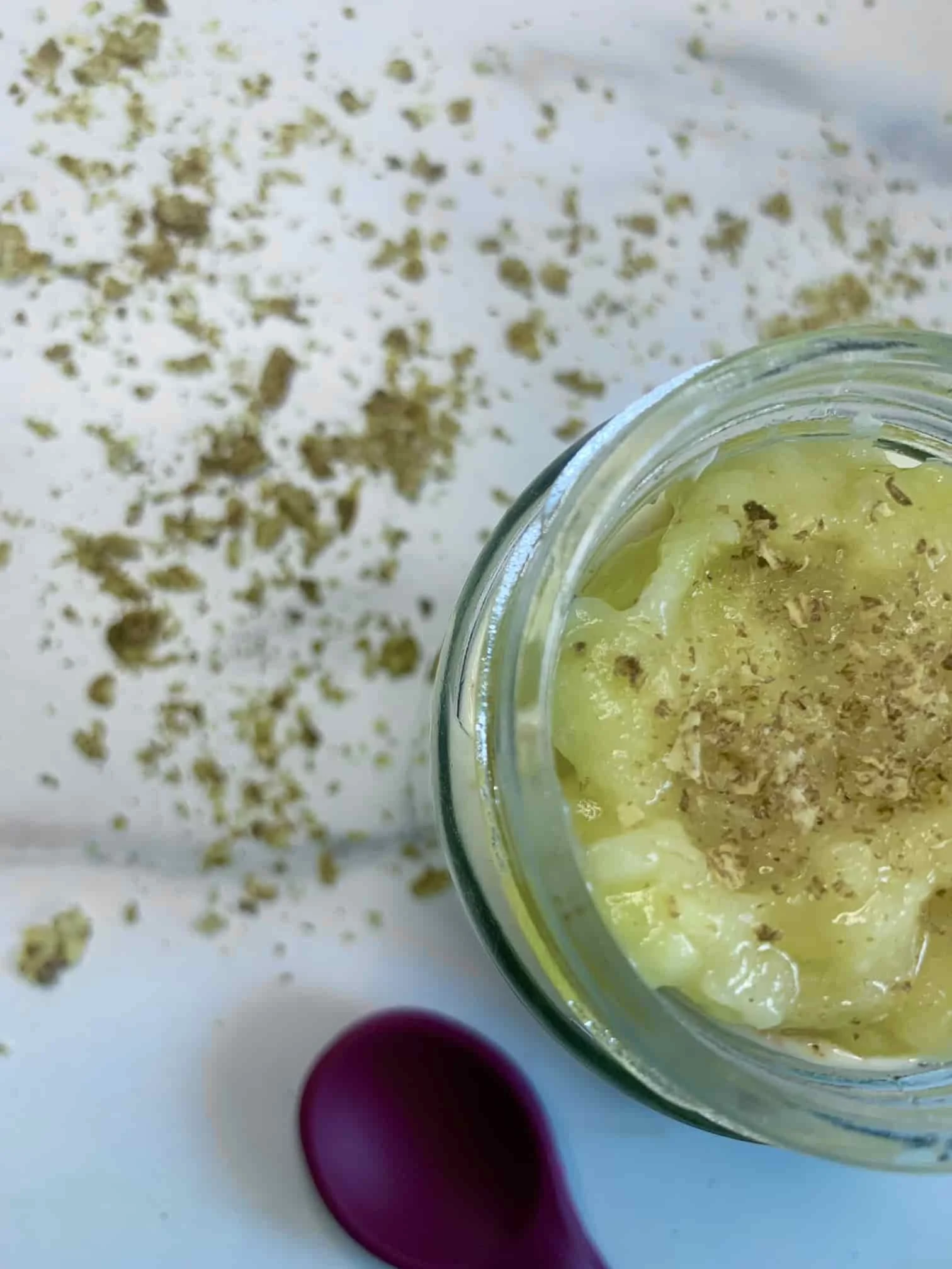 Overhead view of a jar of Weetabix and banana pudding