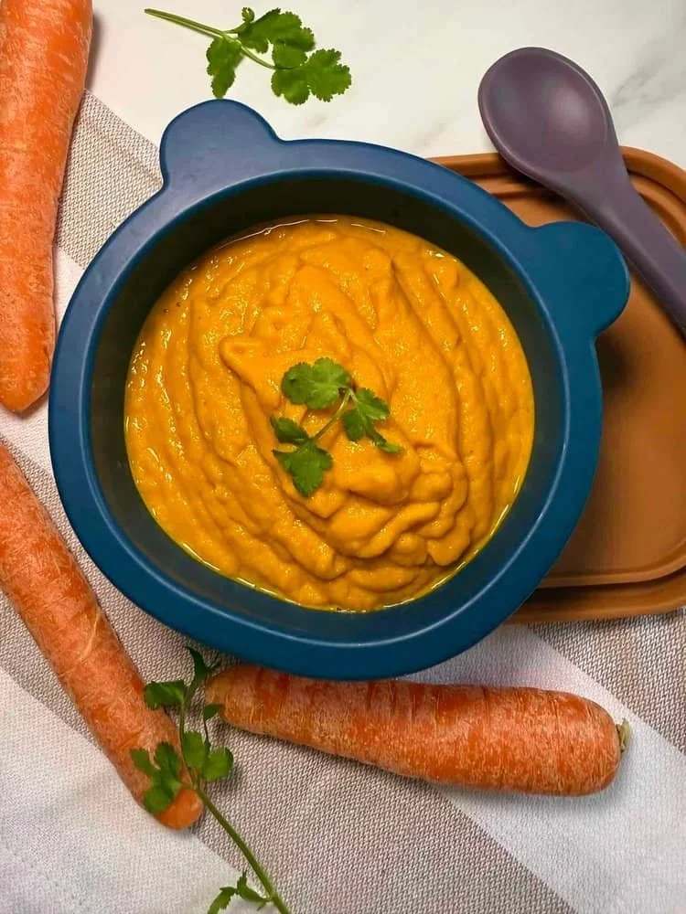 A toddler sized serving of carrot soup