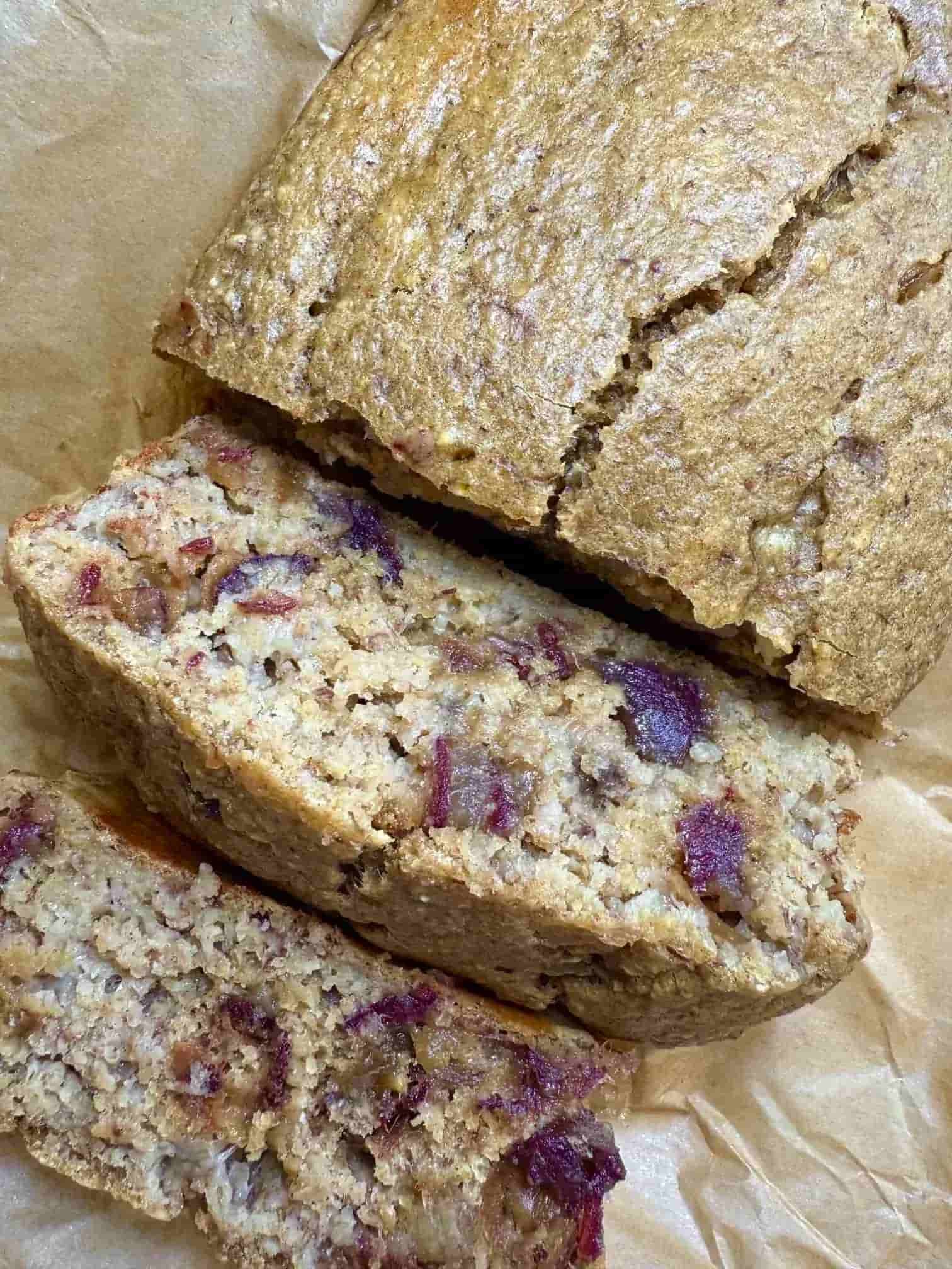 Two pieces of date and banana loaf sliced from the main cake