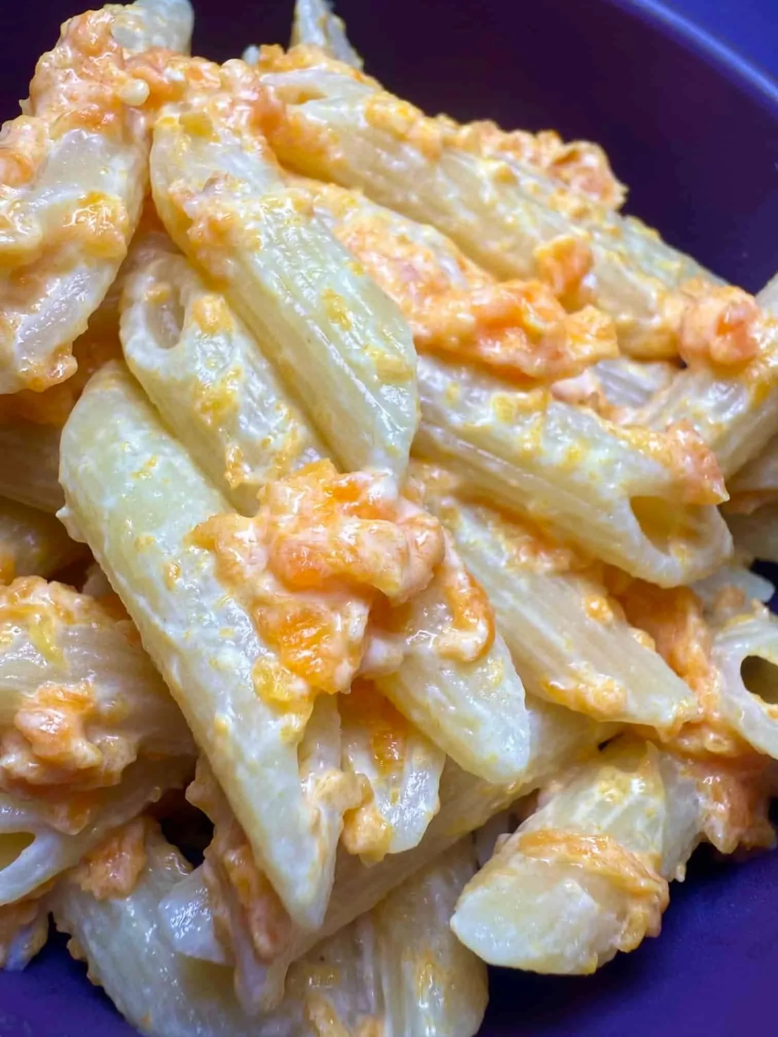A toddler portion of pasta served with a creamy kid-friendly carrot pasta sauce