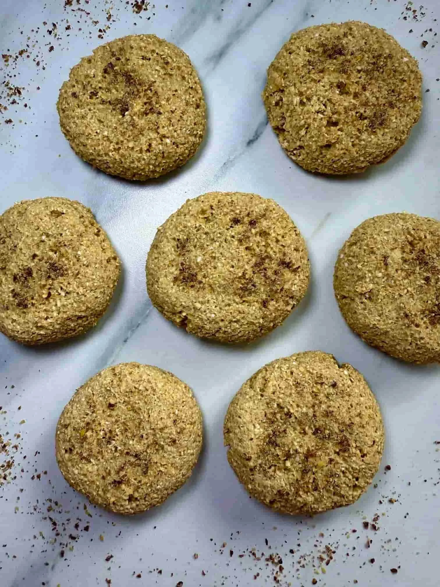 Several cooked mango cookies displayed on serving board