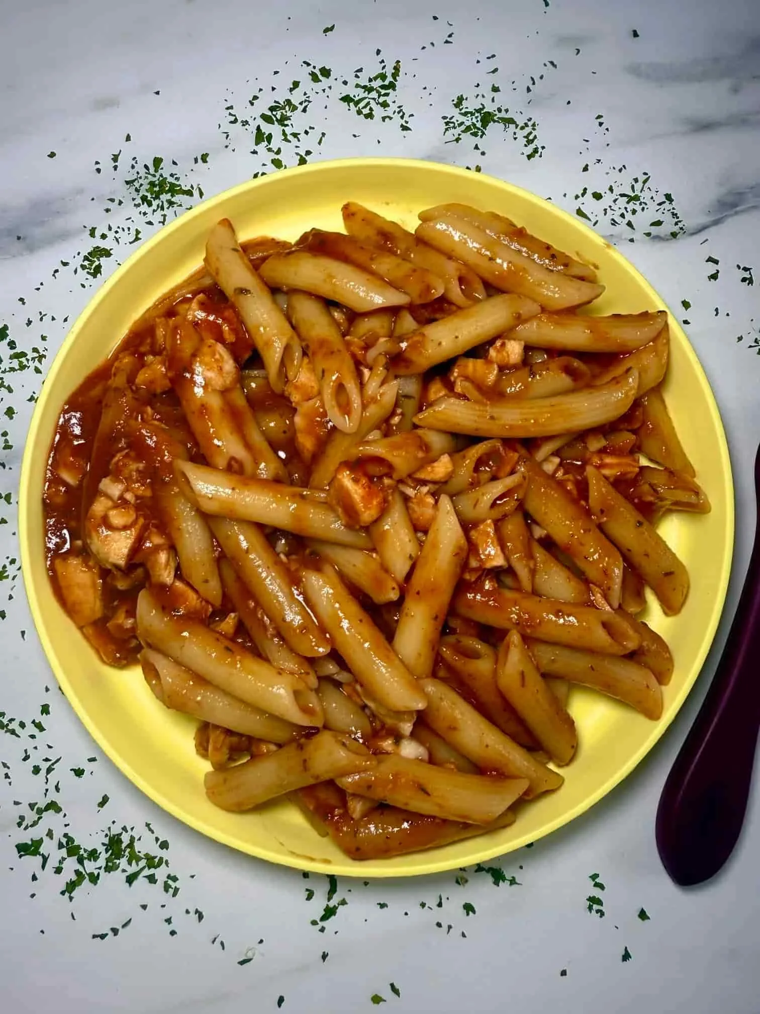 Leftover turkey pasta served on a toddler plate