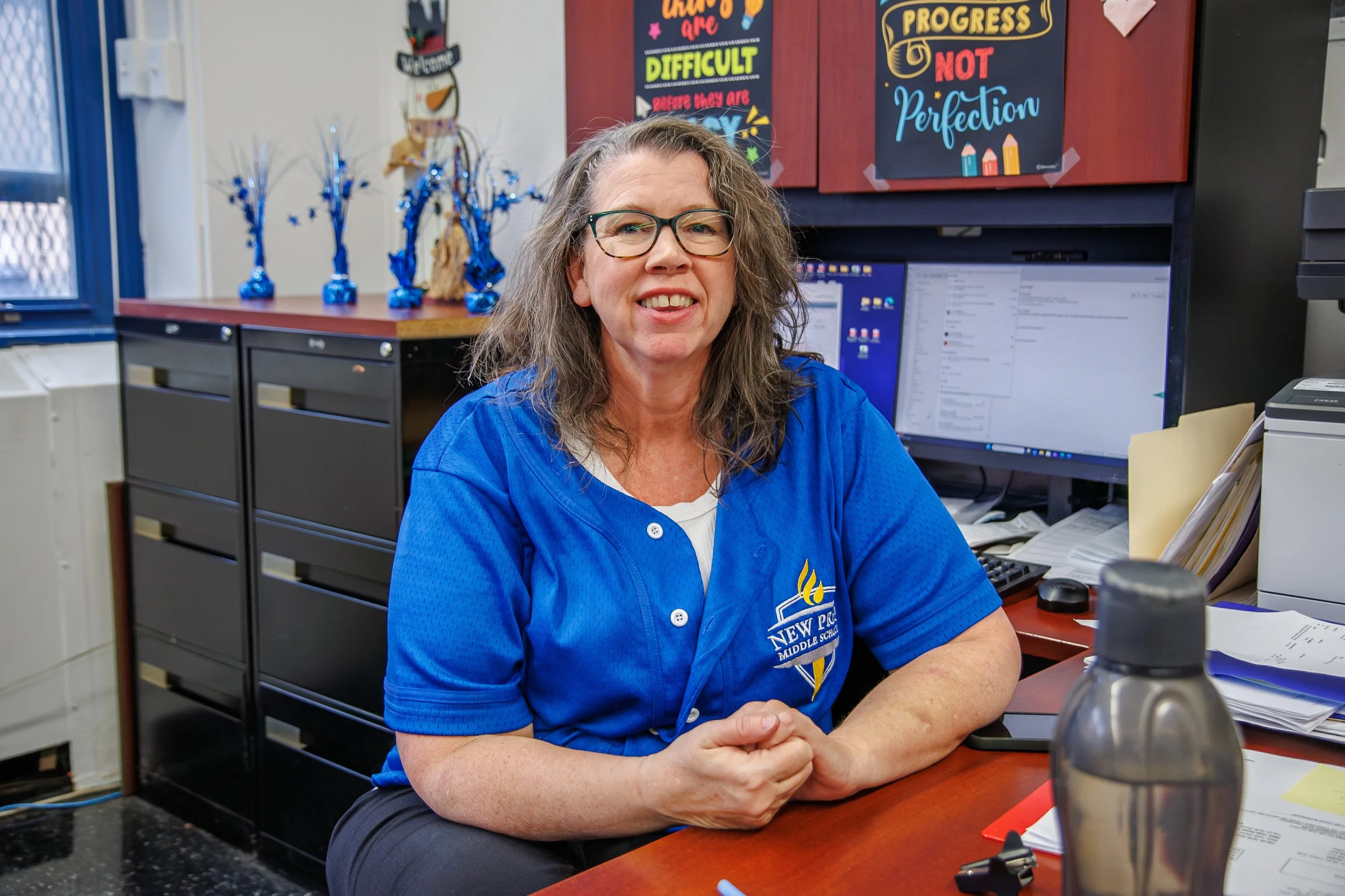 A teacher sit & Smiles