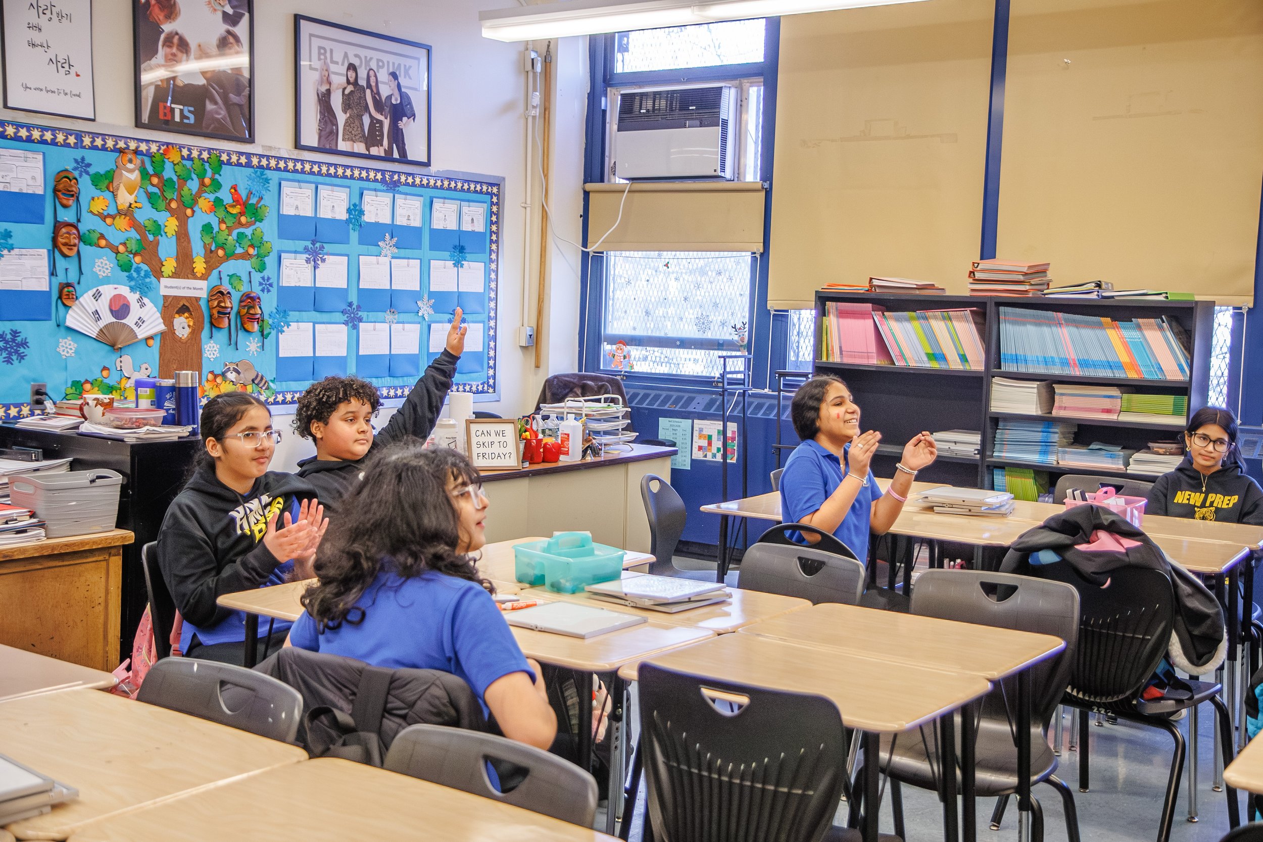 Students sit on table 