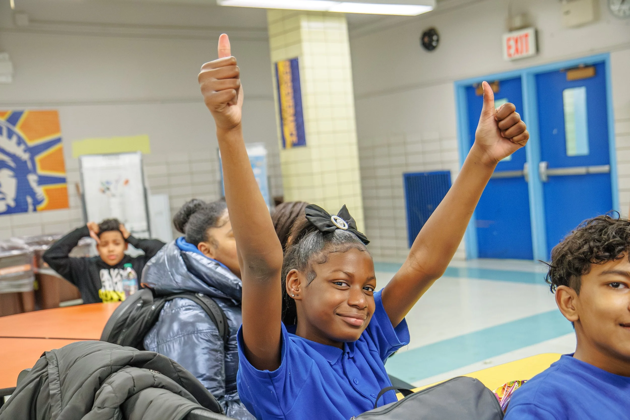A girl raise both hands