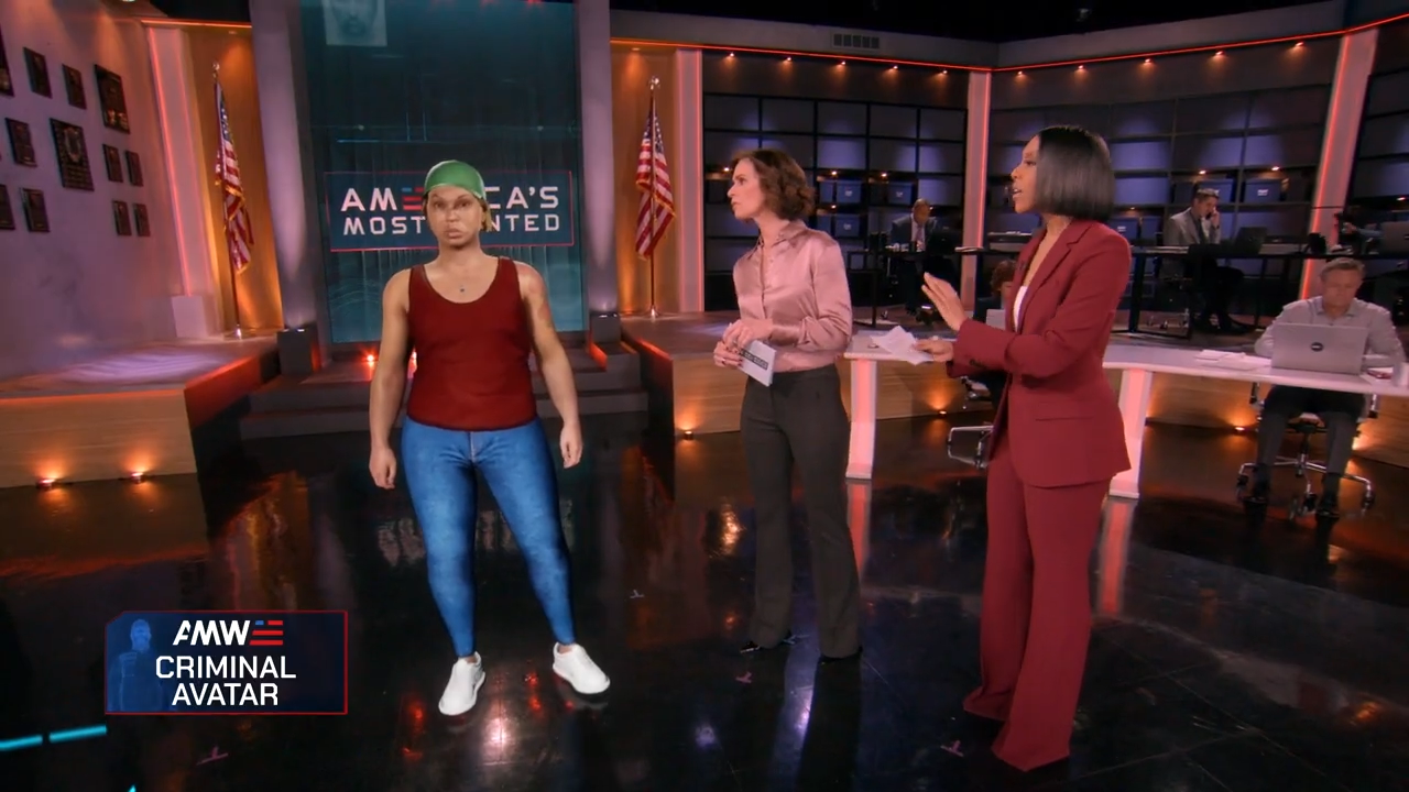 Woman with dyed hair standing on a TV studio set with American flags and a sign reading “America’s Most Wanted,” created with Unreal Engine and Pixotope in a real-time virtual production pipeline.