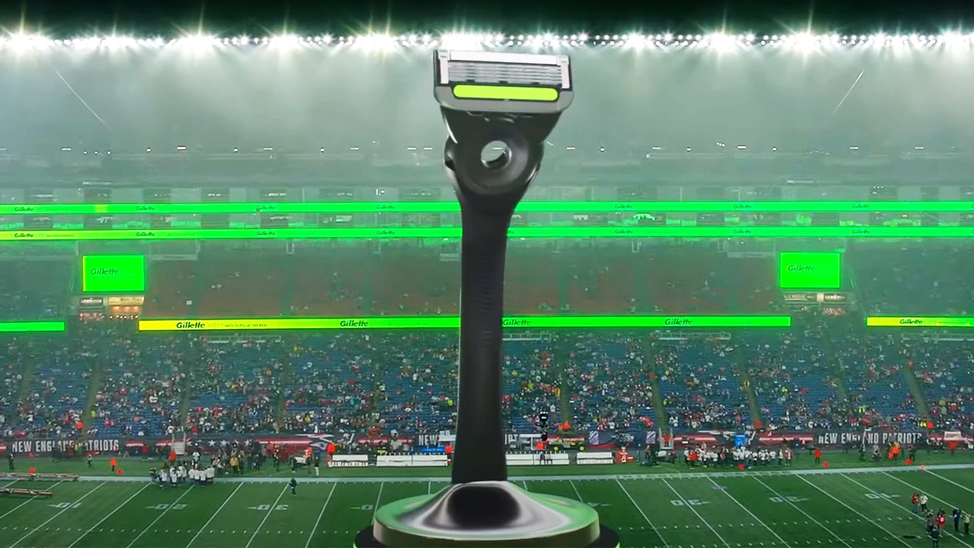 Close-up of a Gillette razor on a stadium seat overlooking a football field and fans through fog, created with Unreal Engine and Pixotope in a real-time virtual production pipeline.