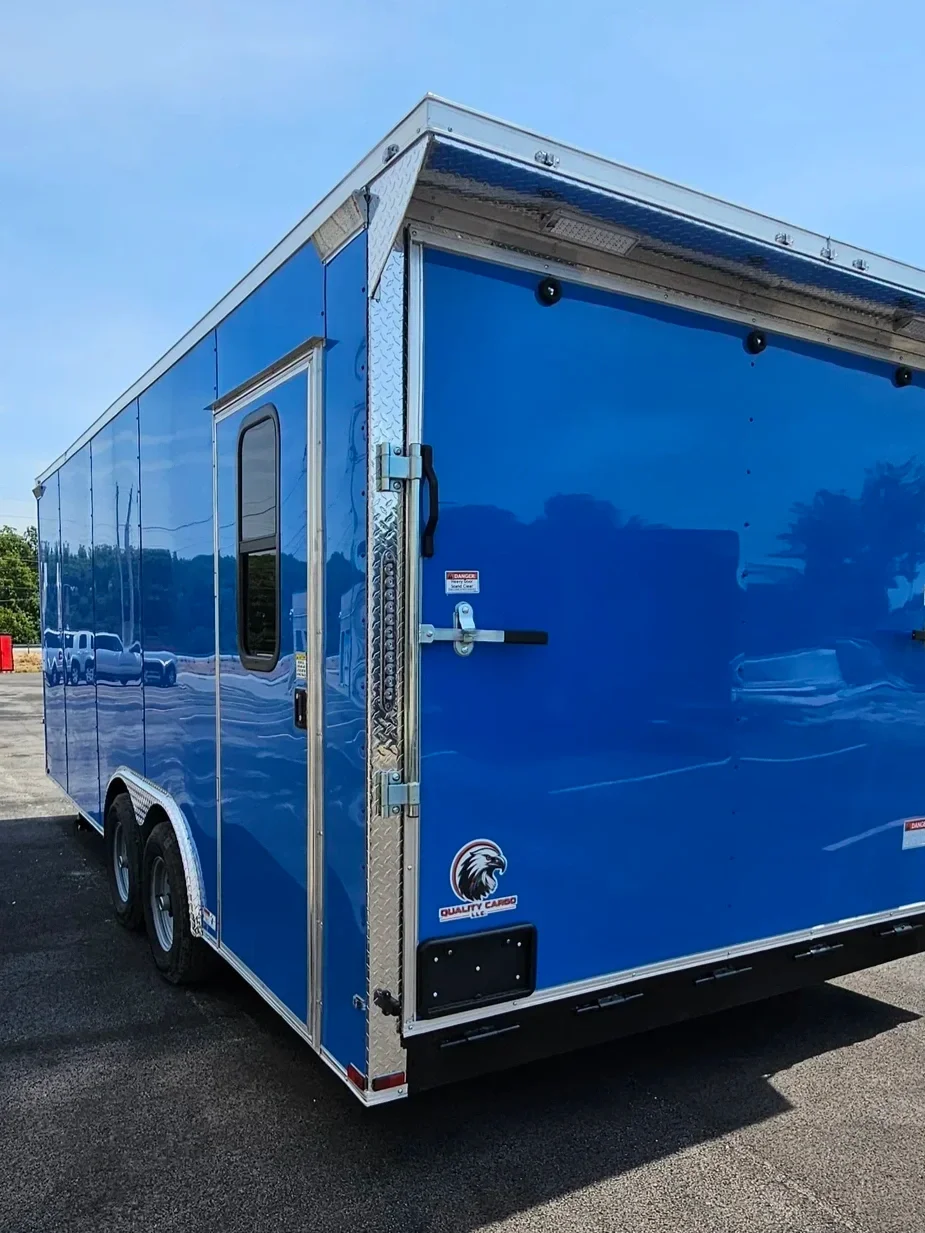 blue food trailer with silver trim and large back door