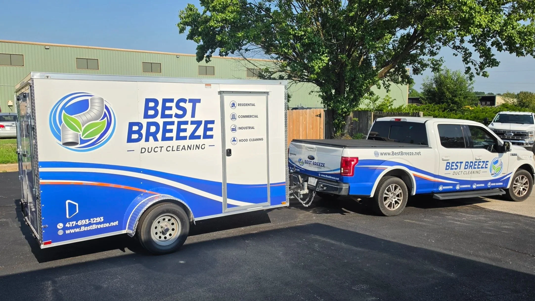 white truck and cargo trailer with a full blue white and green wrap with text that reads Best Breeze Duct Cleanin