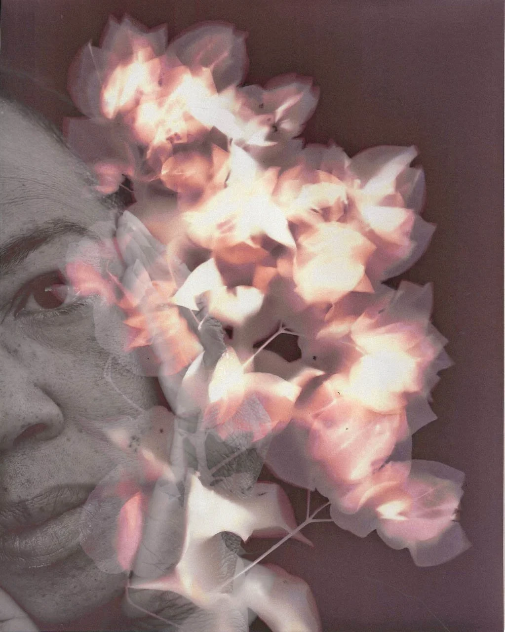 Portrait partially obscured by floral lumen print overlay