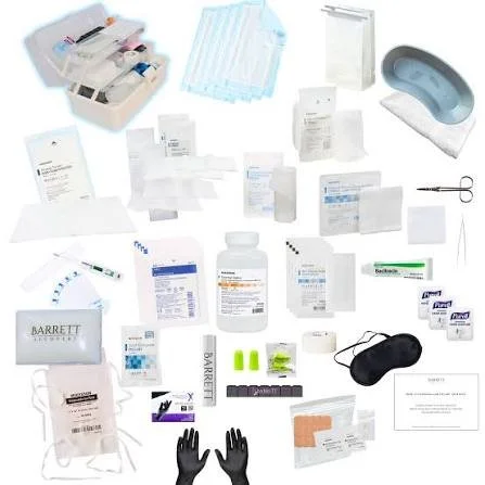 Medical supplies including bandages, scissors, gloves, medication bottles, urinary catheters, and other healthcare items.