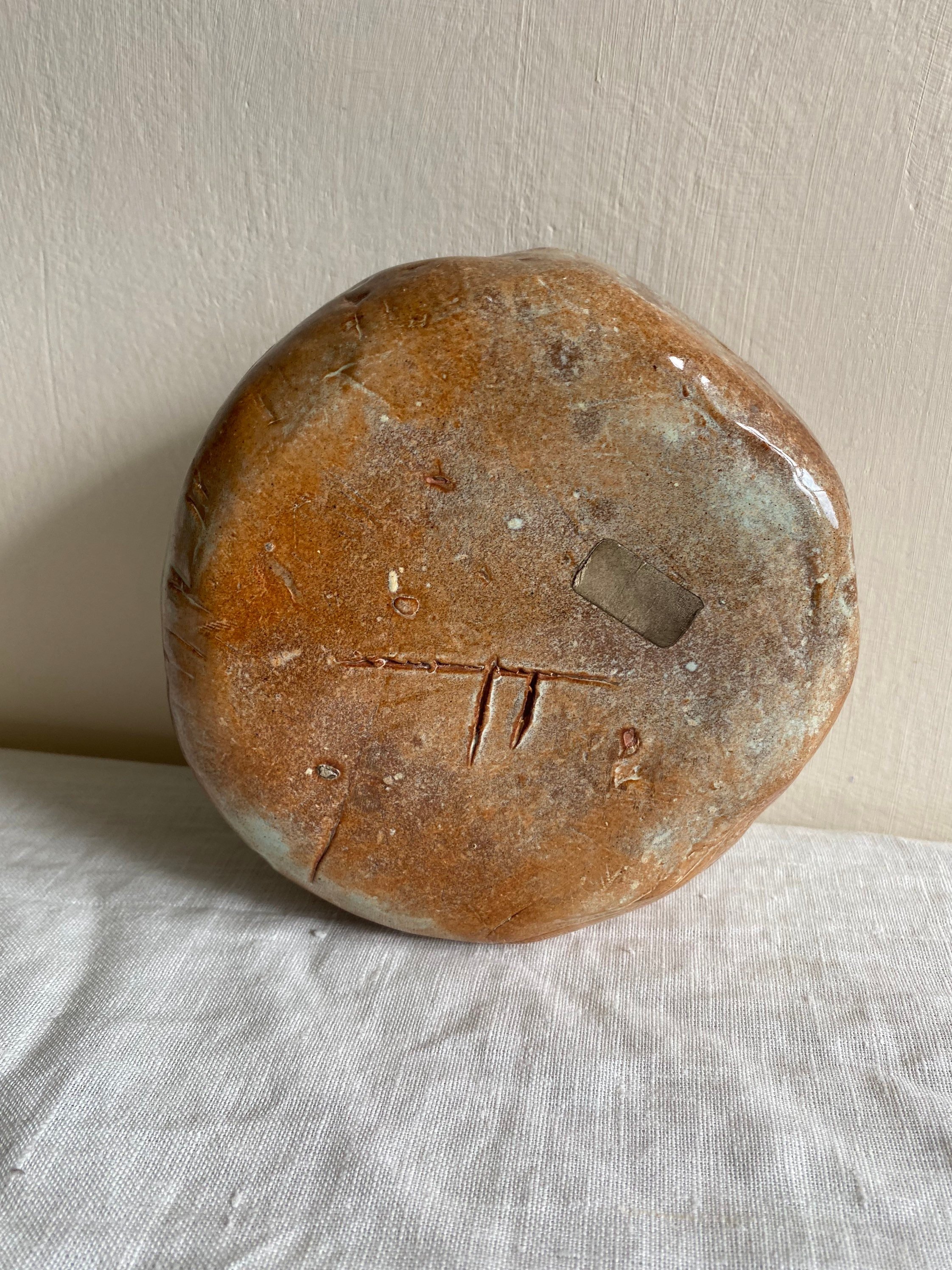 Base of ceramic pen pot or bud vase with artist's signature