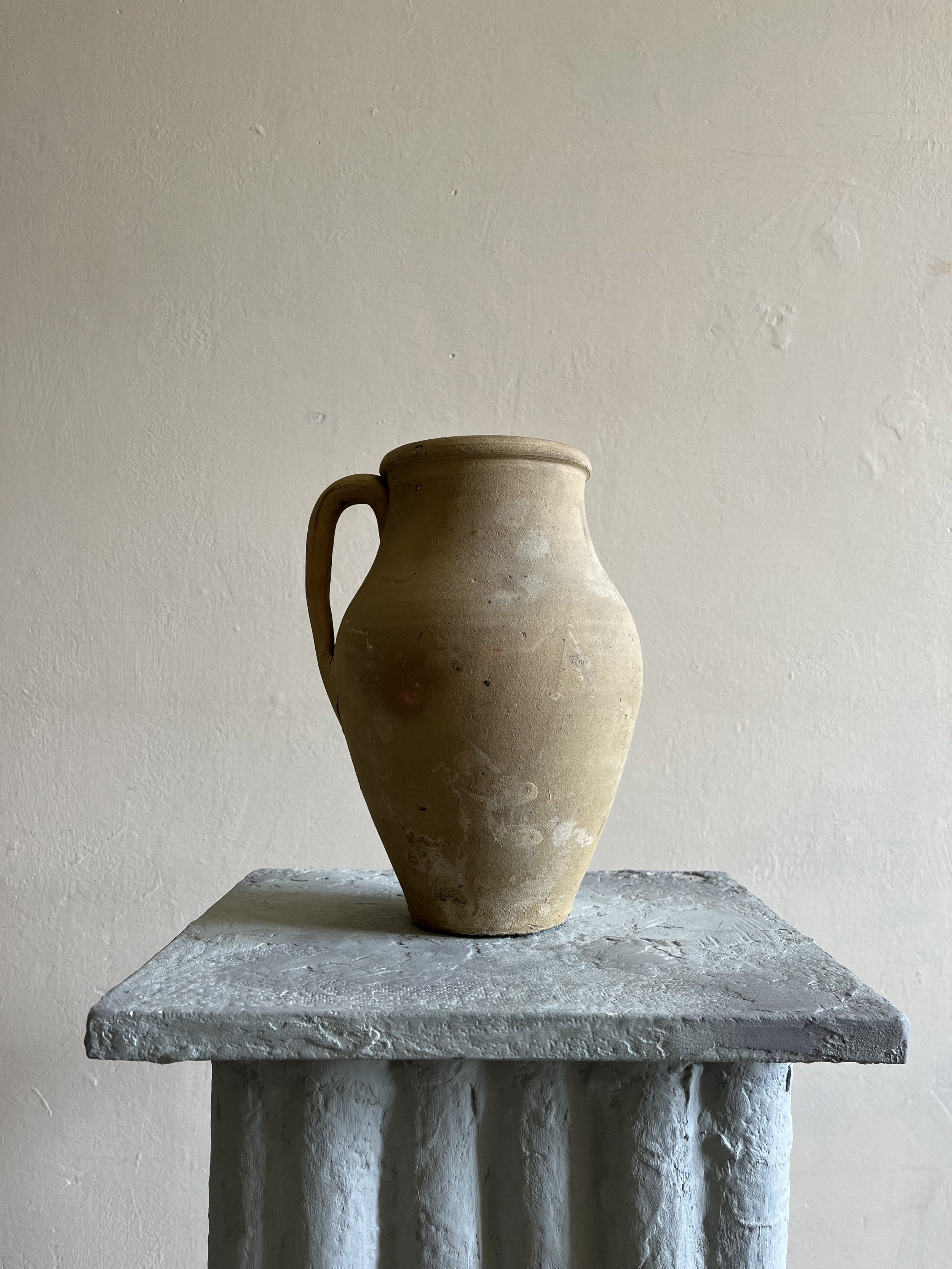Vintage handmade terracotta clay jug or vase