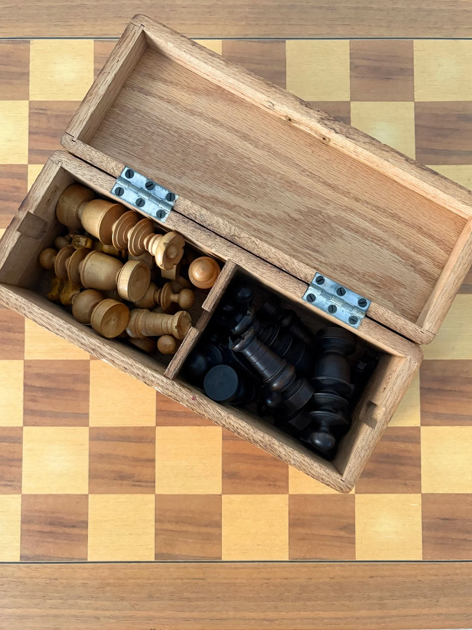 A Mid Century chess set comprising a hand made games board, full suite of solid wood chess men and a storage box - Bureau Bruton