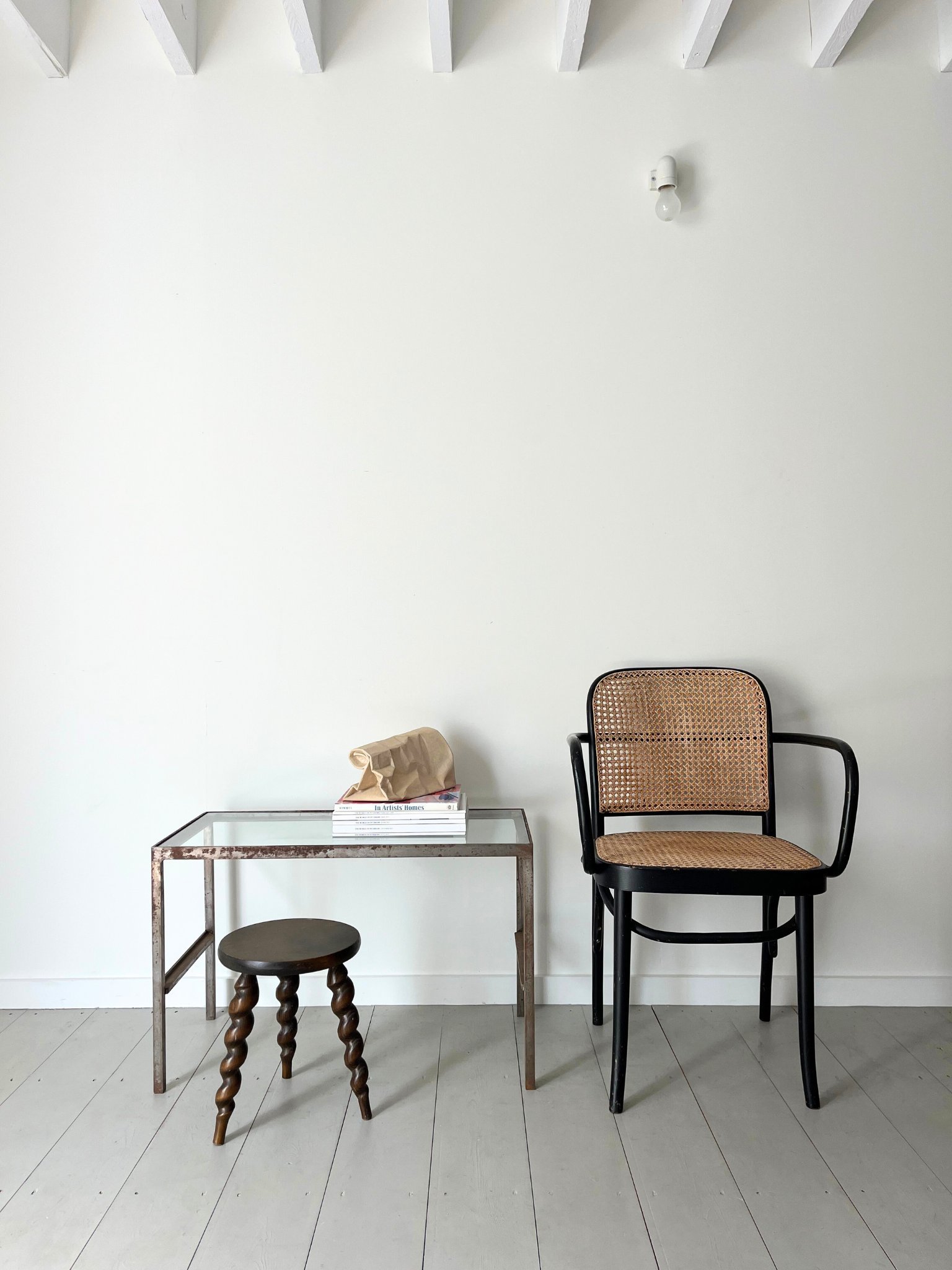 An original Thonet Chair is styled here with an industrial design side table and a modernist French milking stool - Bureau Bruton Design and Antiques Store