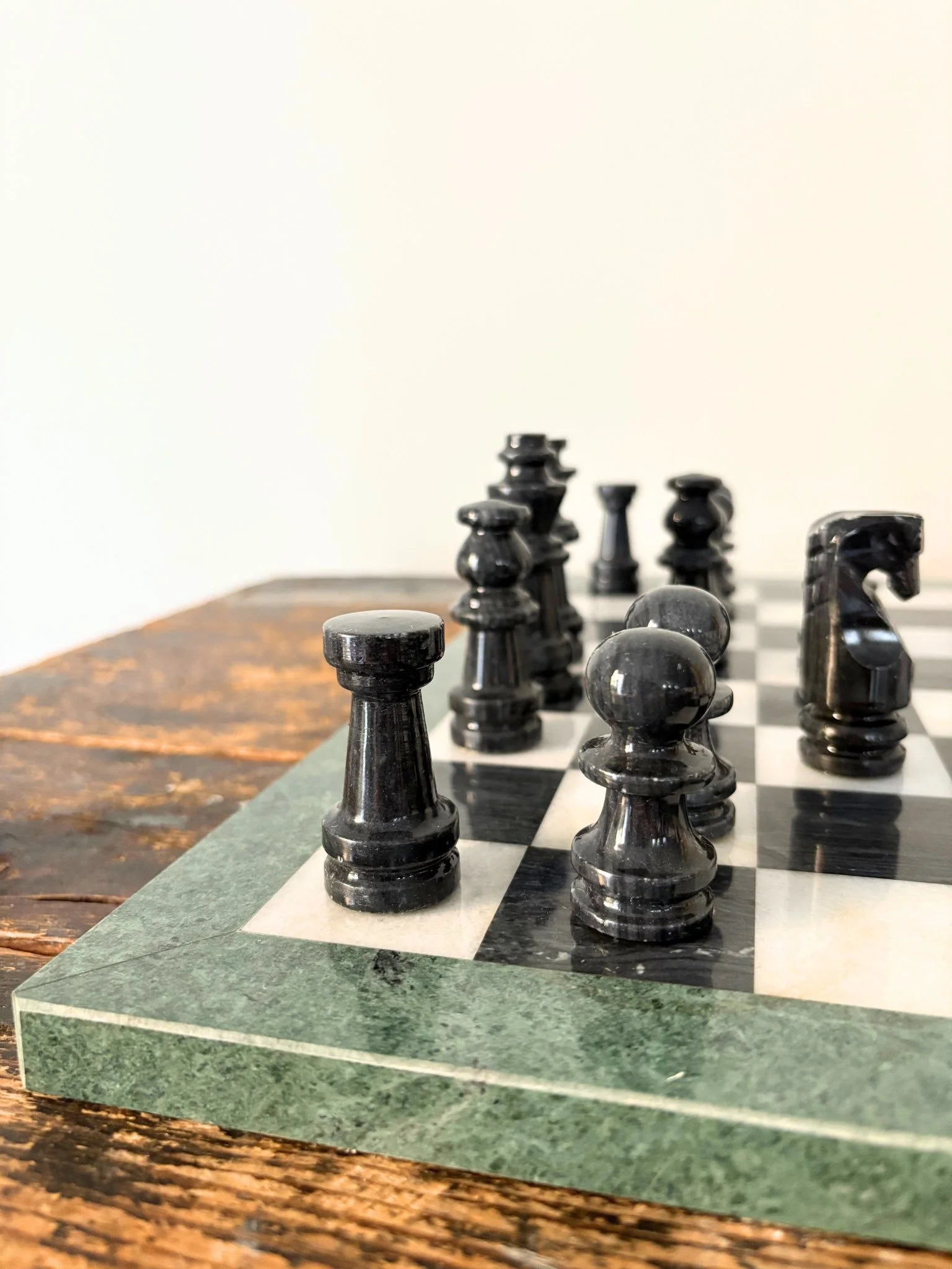 Green Chess Board With Black and White Marble Pieces - Bureau Bruton