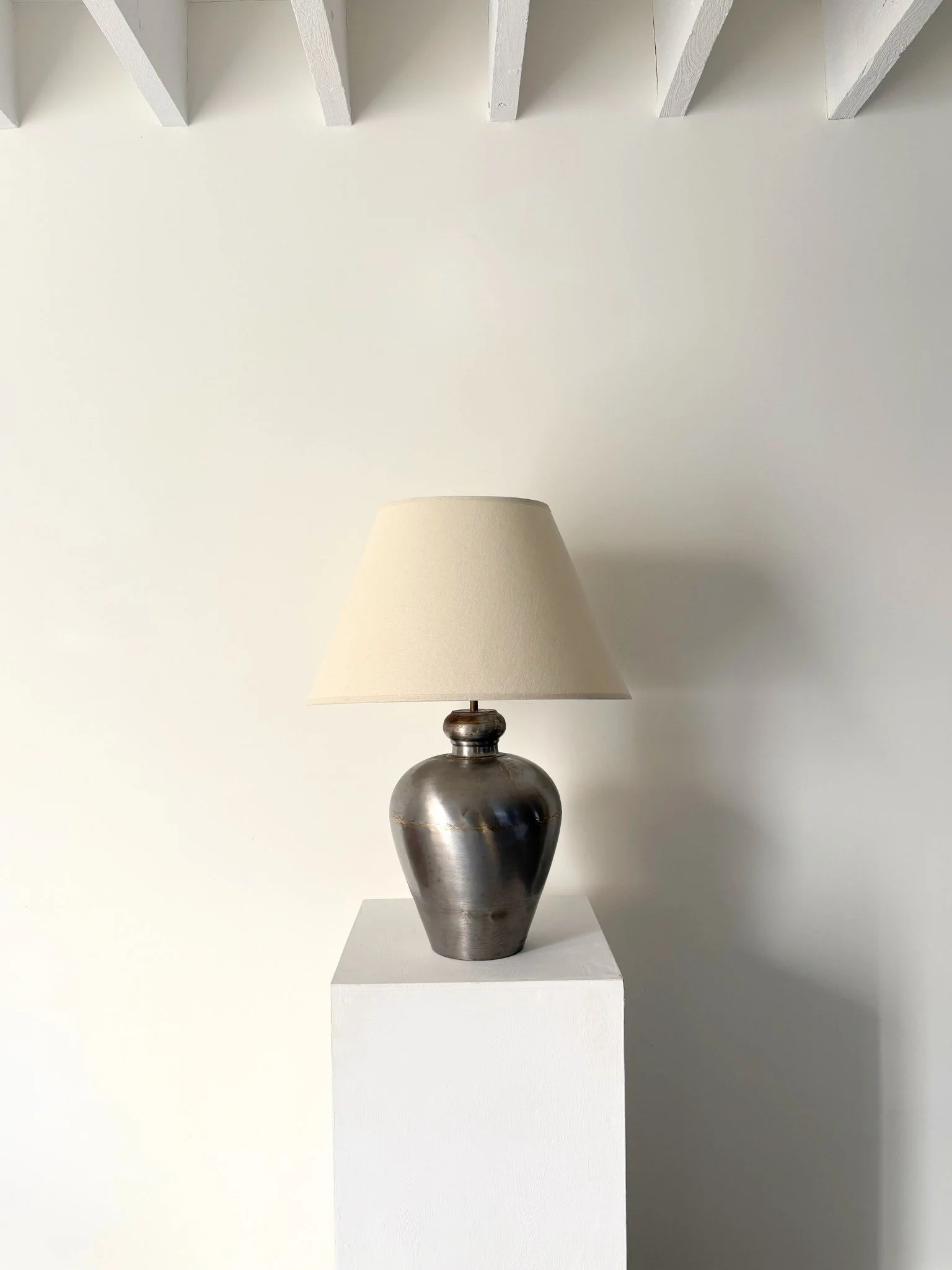 A large vintage table lamp in polished metal with brass infill accents around the diameter - Bureau Bruton Antiques and Design Shop