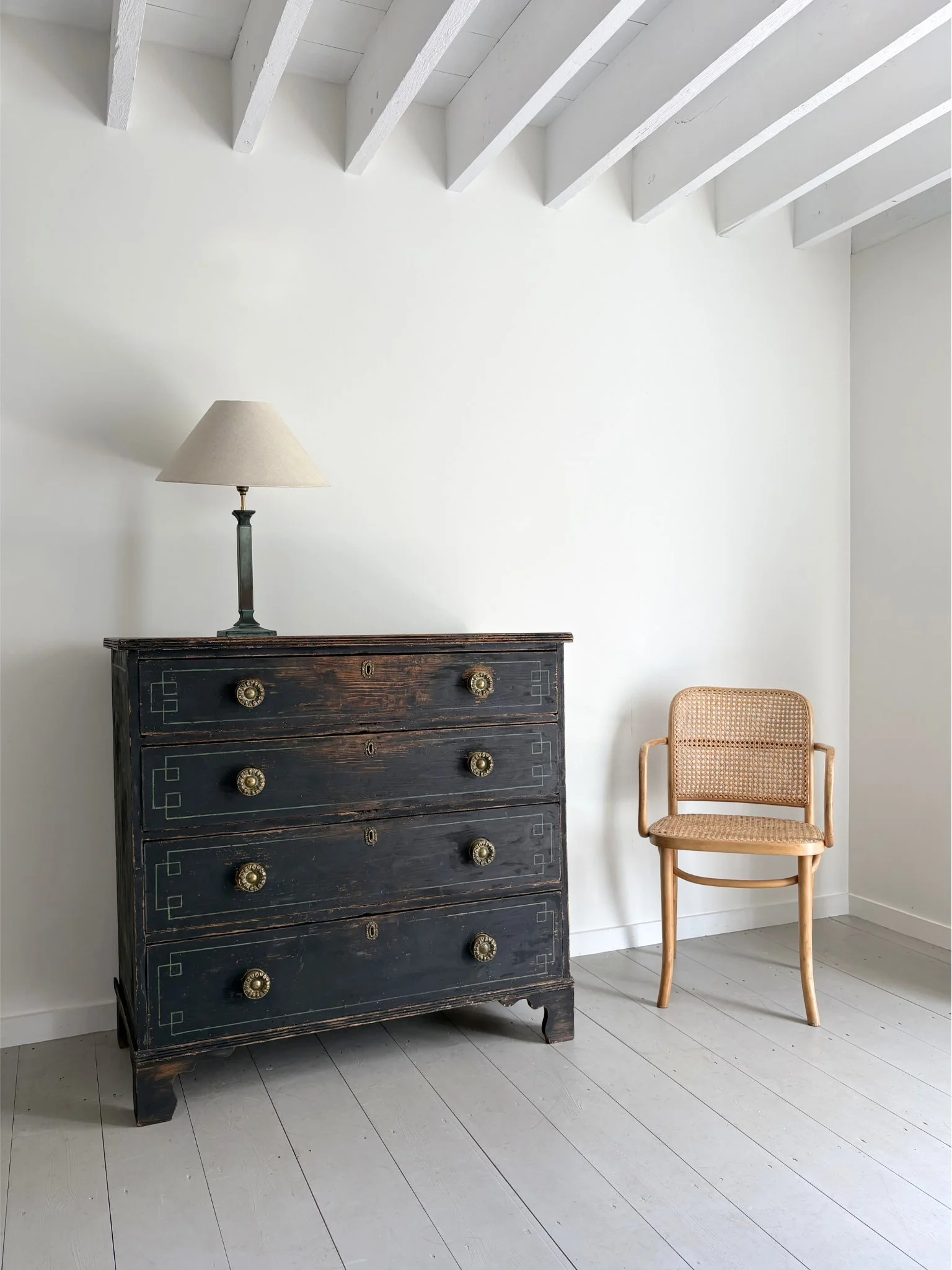 Our Verdigris Column Lamp, sits atop our Geometric Painted Chest of Drawers - Bureau Bruton