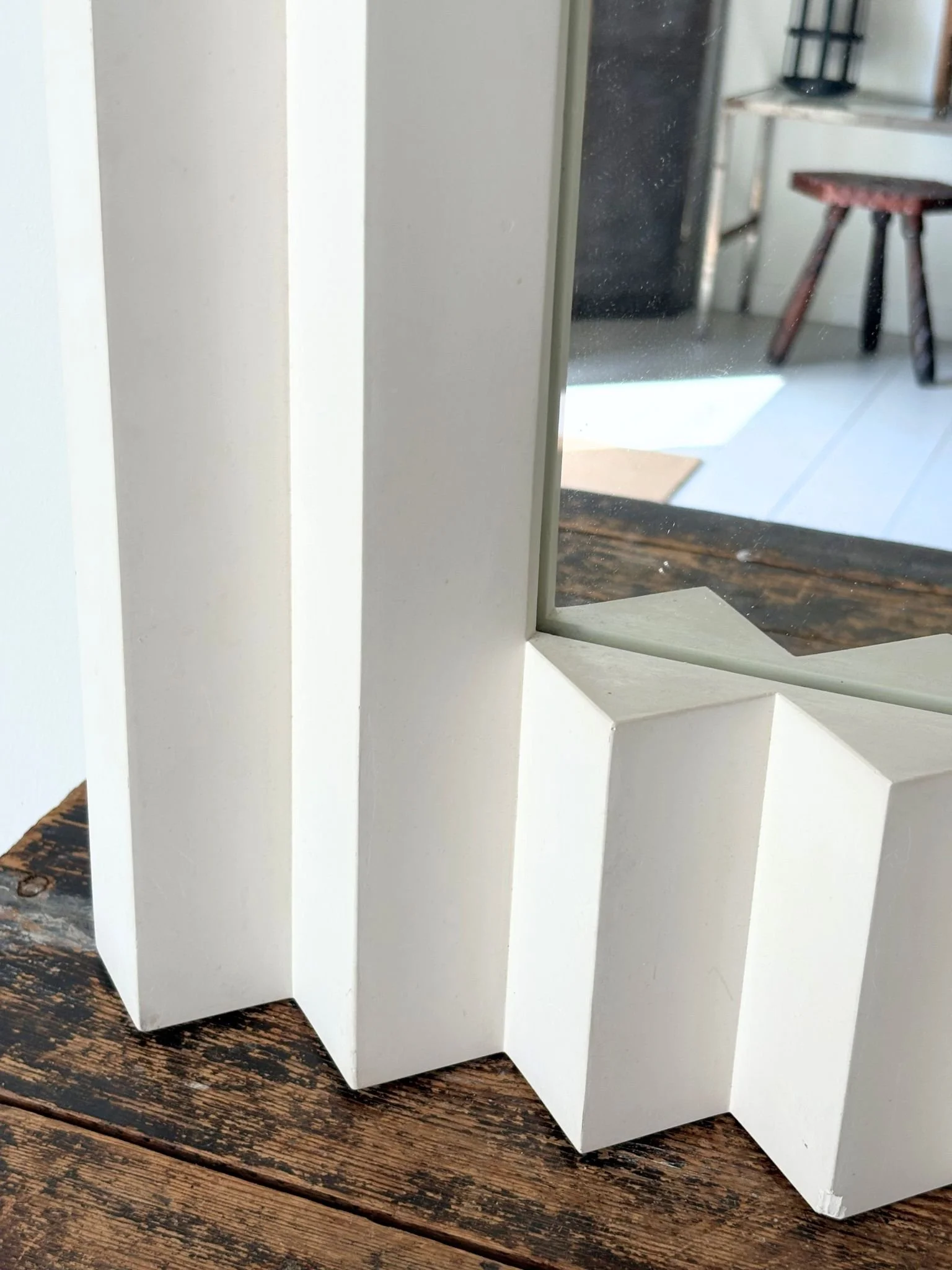 The corner of our Ricochet Plaster Mirror by French design studio Atelier Sedap - Bureau Bruton Antiques and Vintage shop