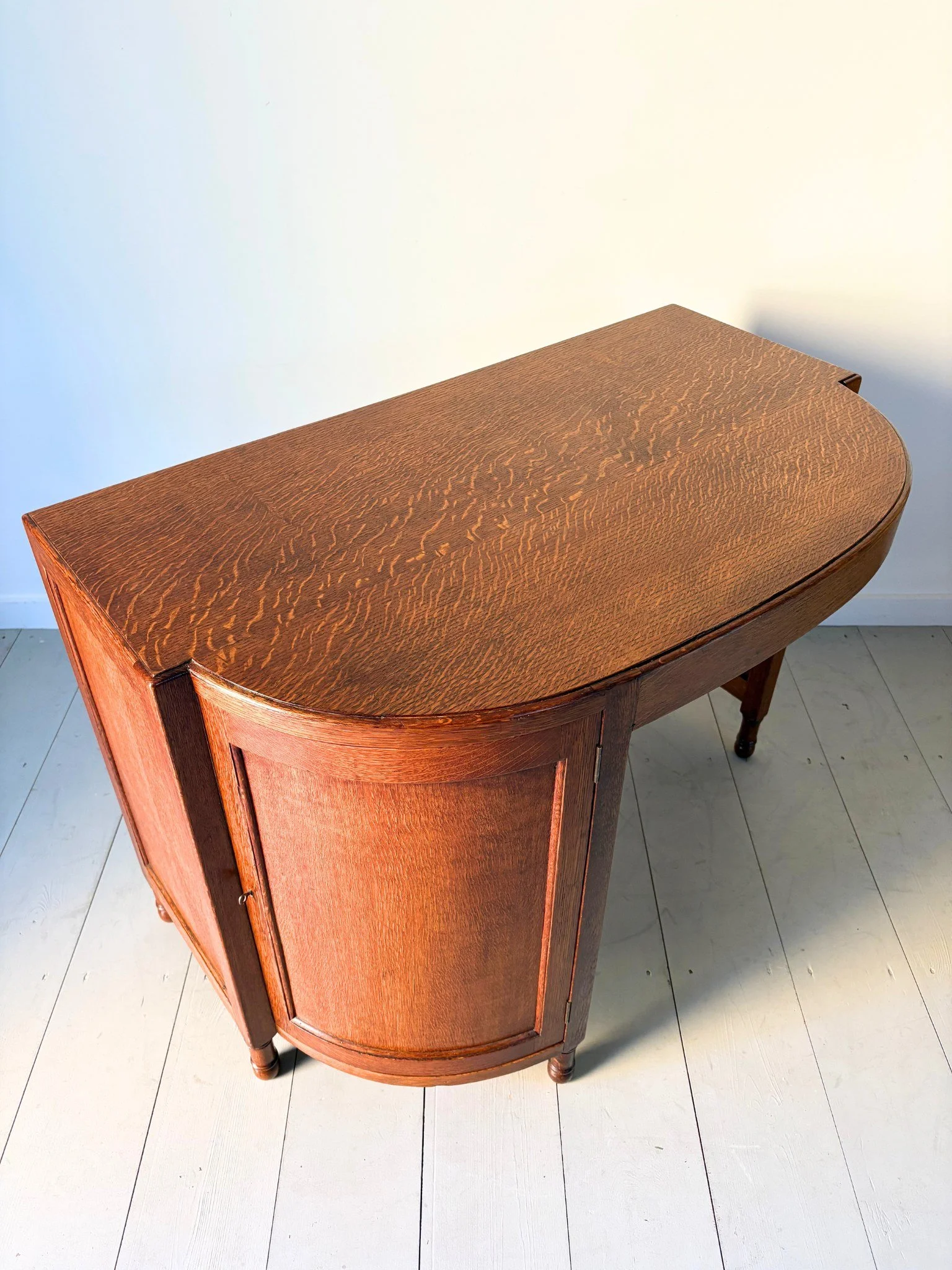 This 1930s Heals desk has a demi lune top giving a lovely curvature to the back - Bureau Bruton