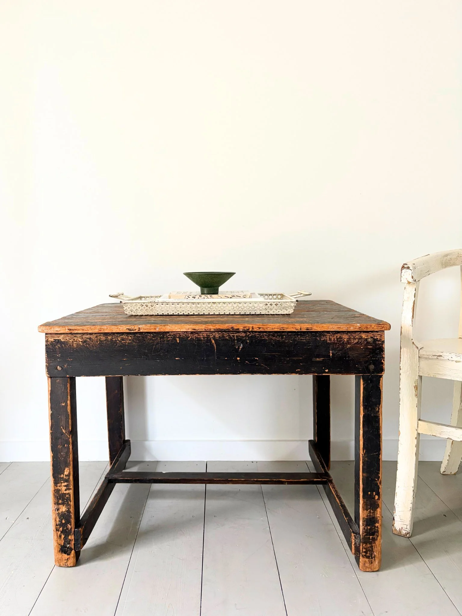 A Mid Century Conical Vallauris Bowl sits atop a Mathieu Matégot Perforated Steel Tray - Bureau Bruton Vintage Sourcing and Shop