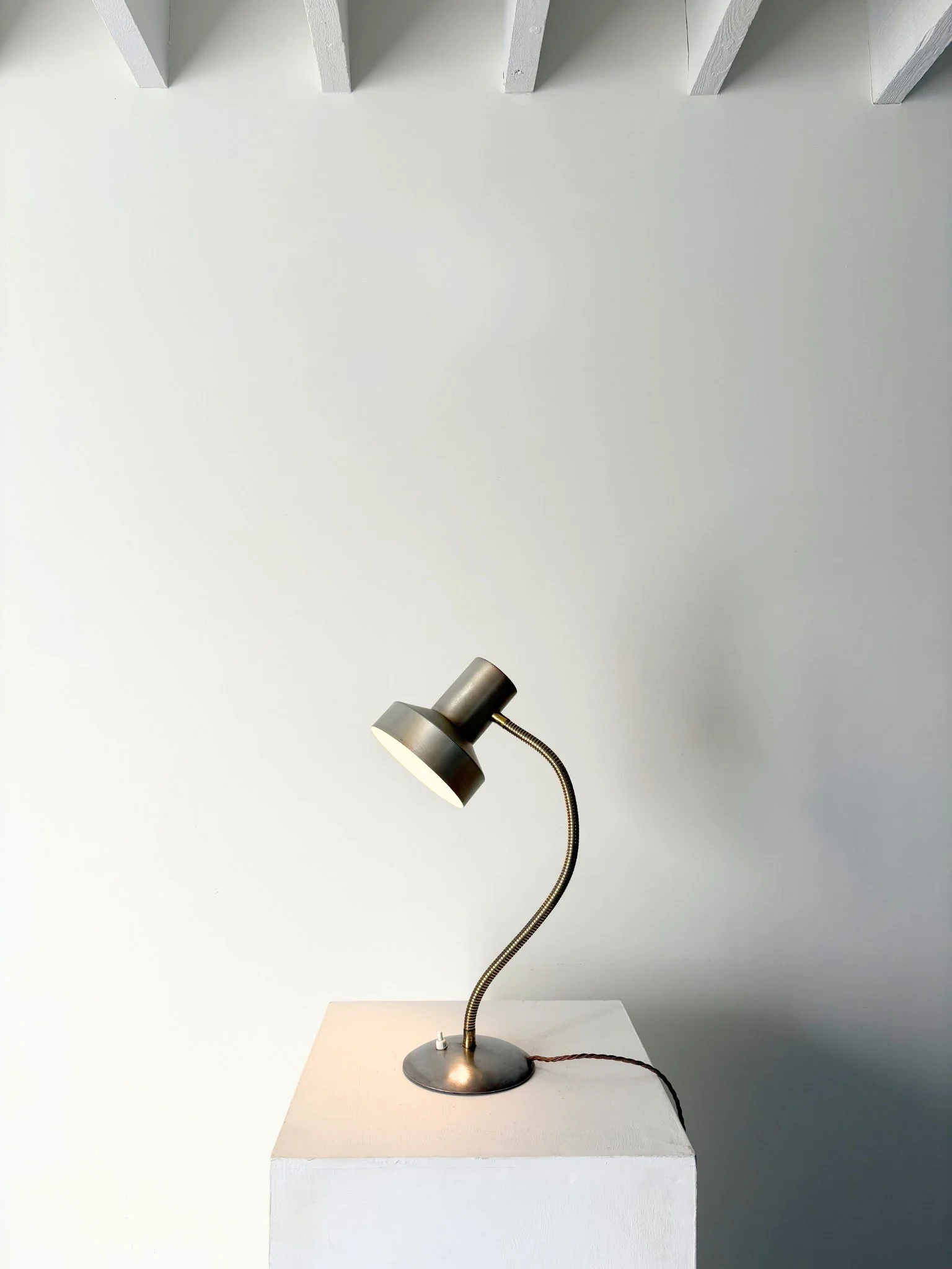 A sleek vintage side light or desk lamp with integrated brushed aluminium shade, flexible goose neck in brass, and a weighted domed base - Bureau Bruton Antiques and Vintage