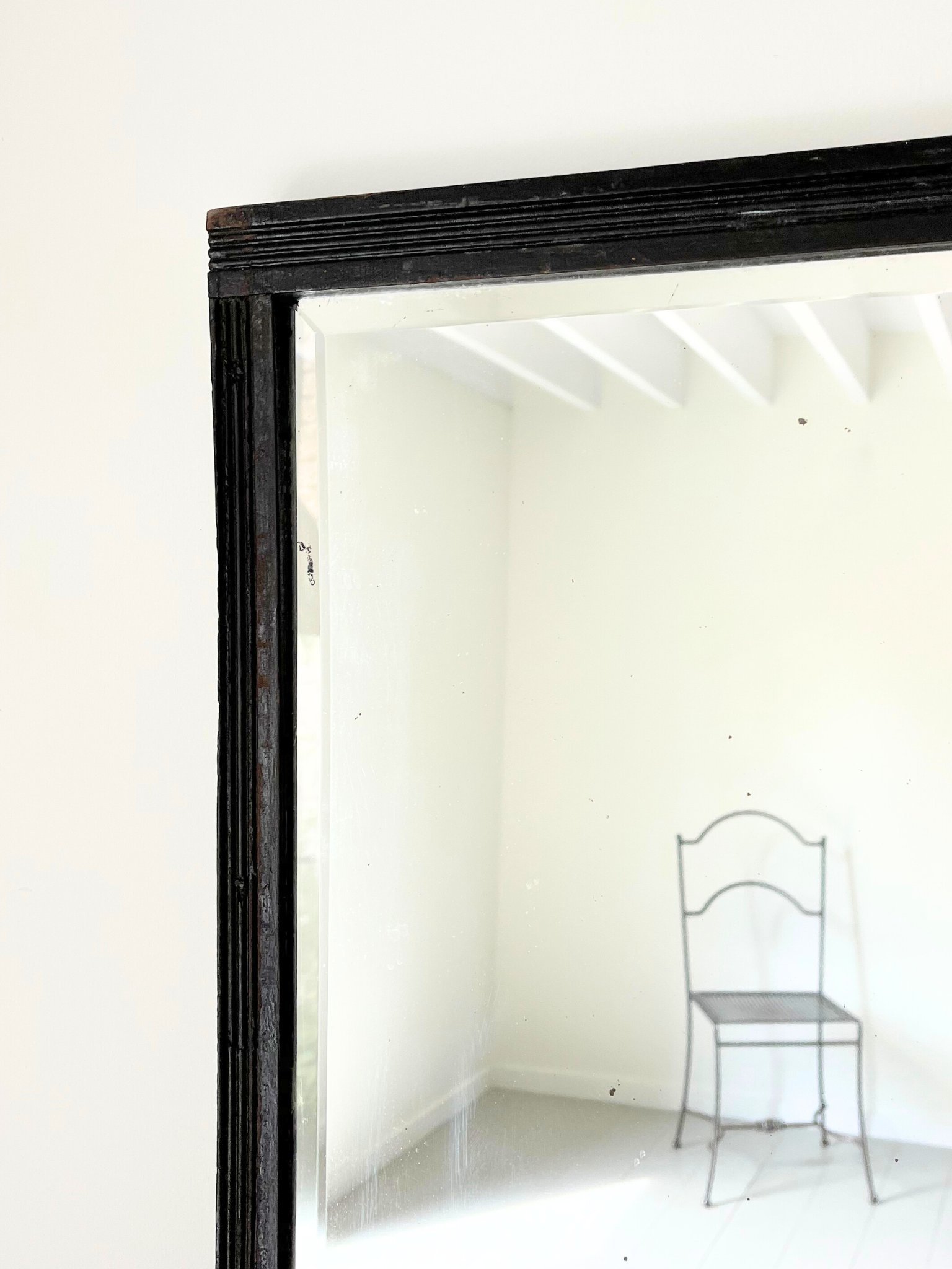 Corner detail of our Ebonised Reeded Mirror, on view now at Bureau Bruton showroom