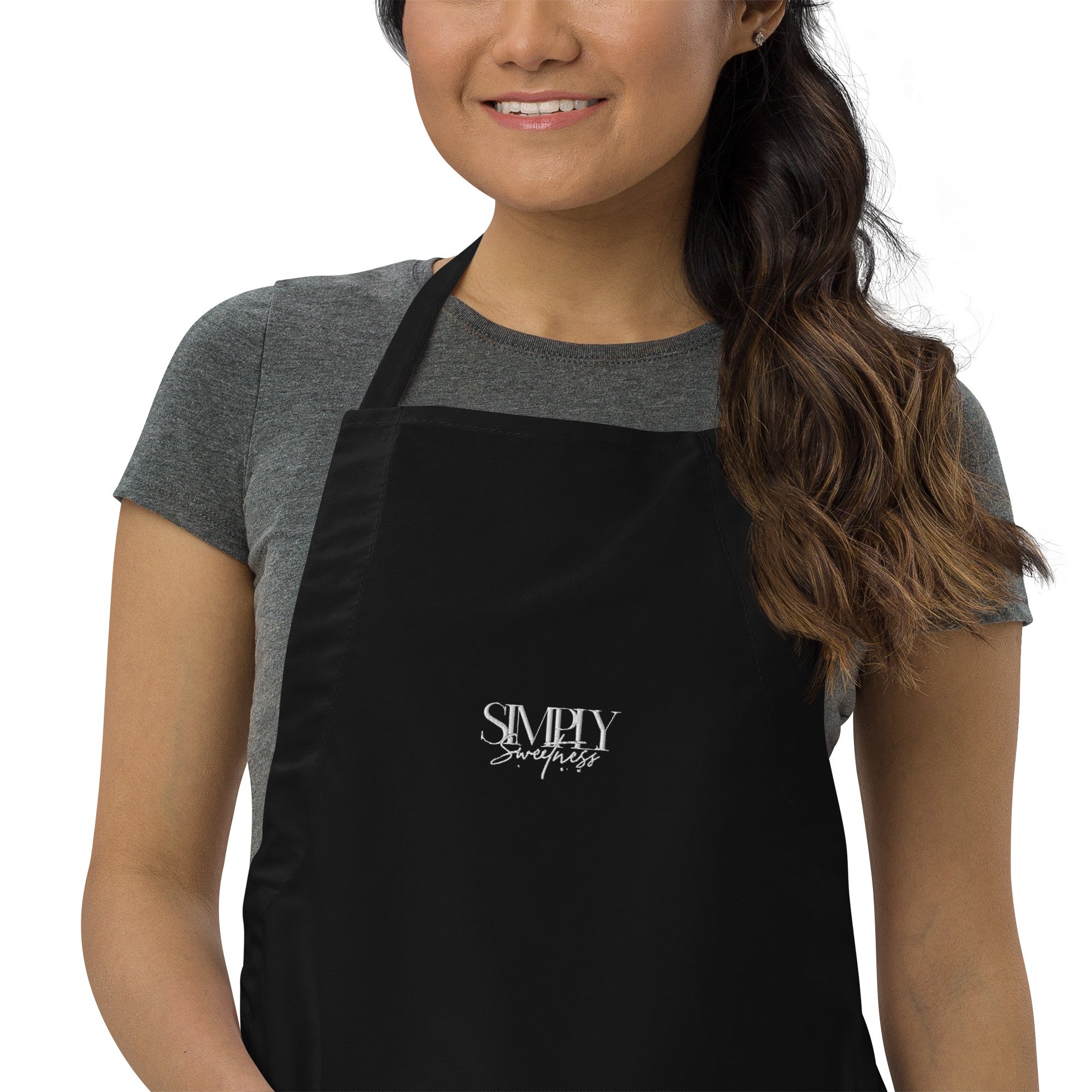 embroidered-apron-black-zoomed-in-64d76abeca188.jpg