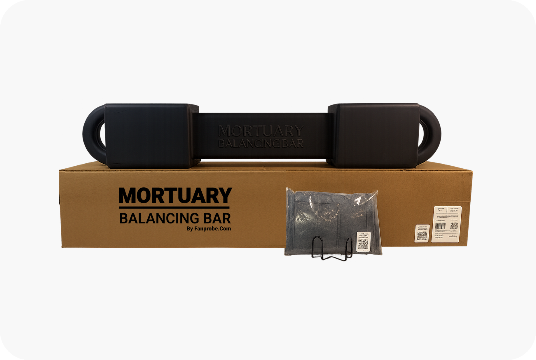 A black Mortuary Balancing Bar placed on top of its cardboard box, with a small accessory in a transparent plastic bag in front.