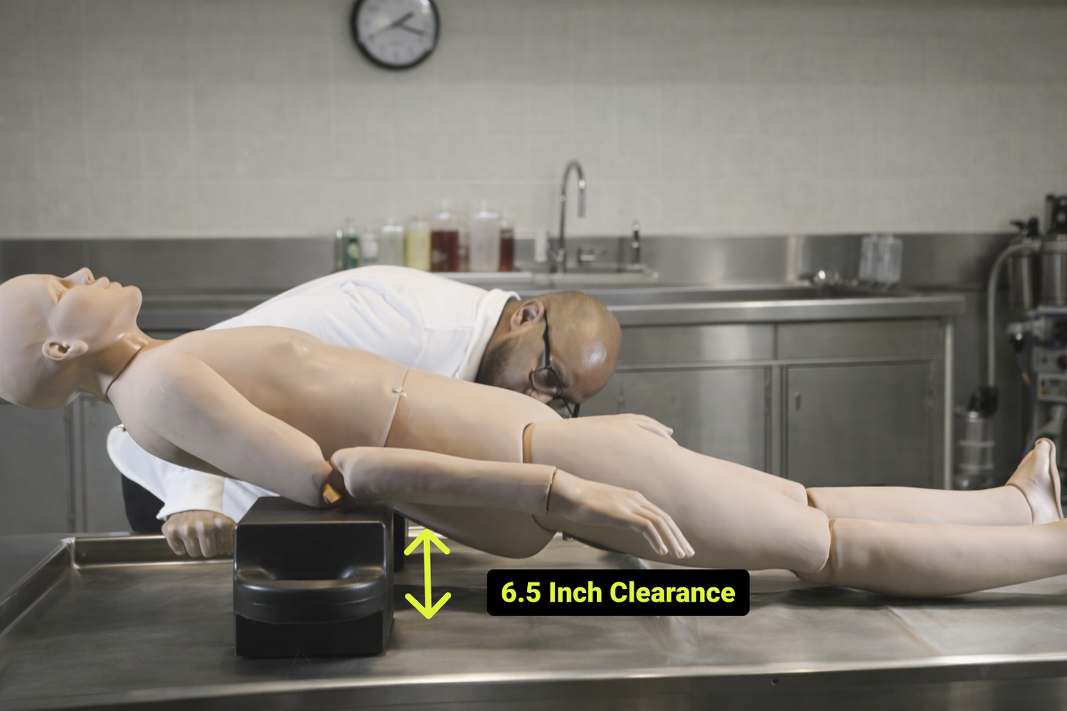 Mortuary Balancing Bar positioned beneath the lower lumbar and creating 6.5 inches of working clearance